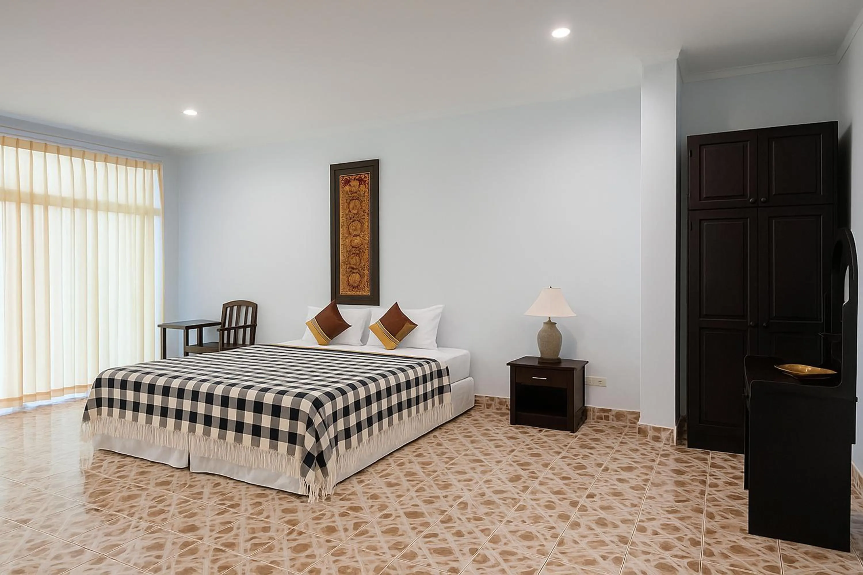 Bed in Kamala Orchid Guesthouse