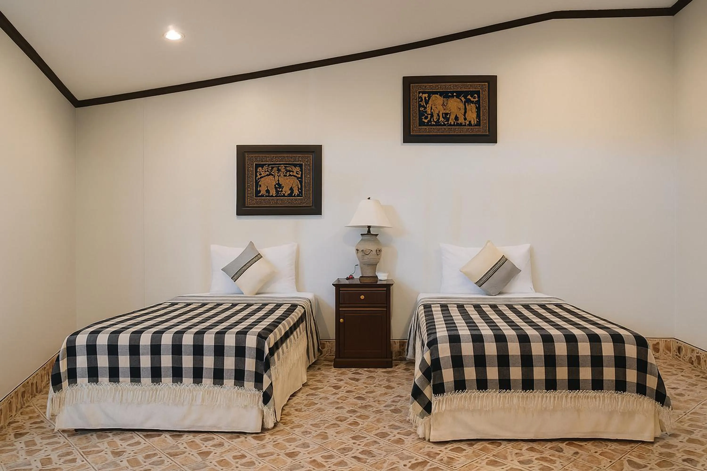 Bed in Kamala Orchid Guesthouse