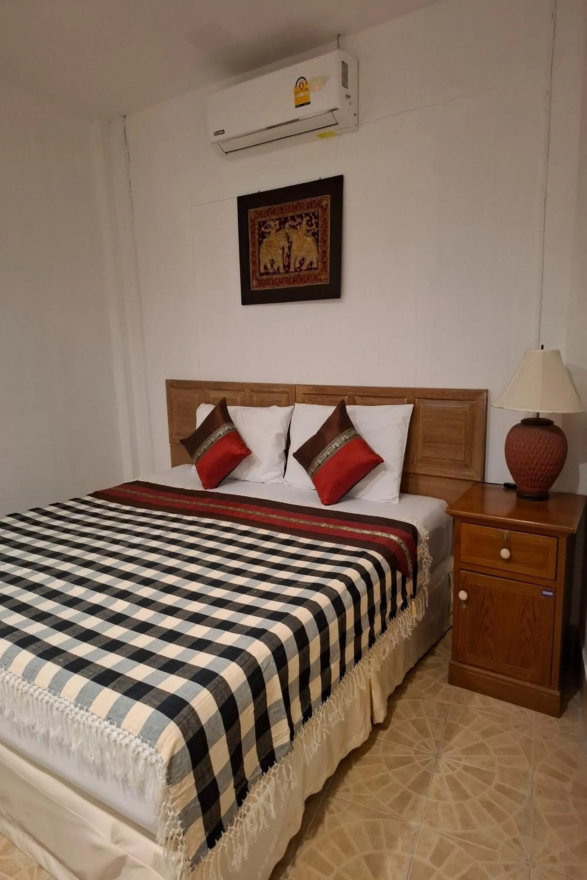 Bed in Kamala Orchid Guesthouse