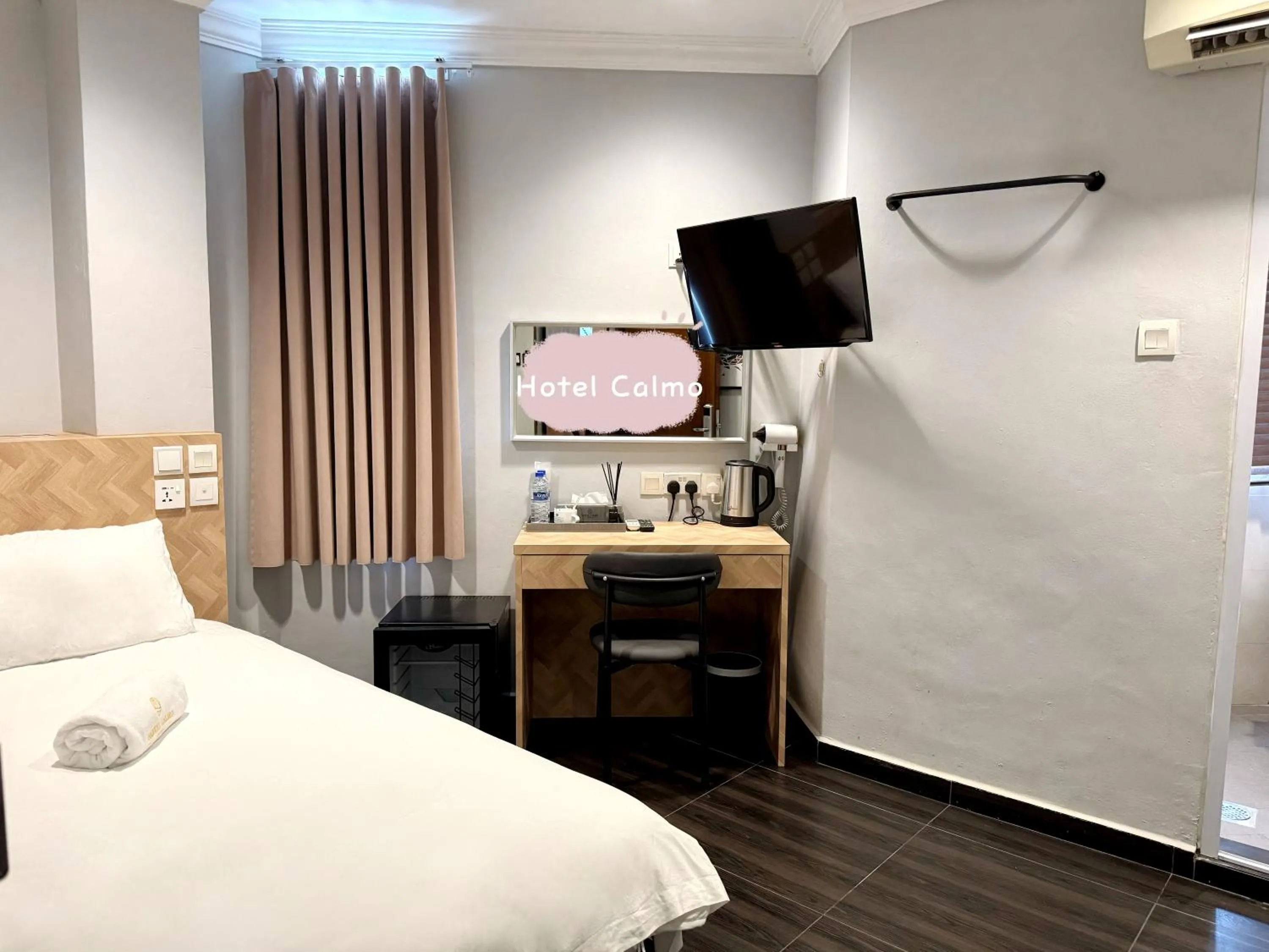 Bed in Hotel Calmo Hamilton