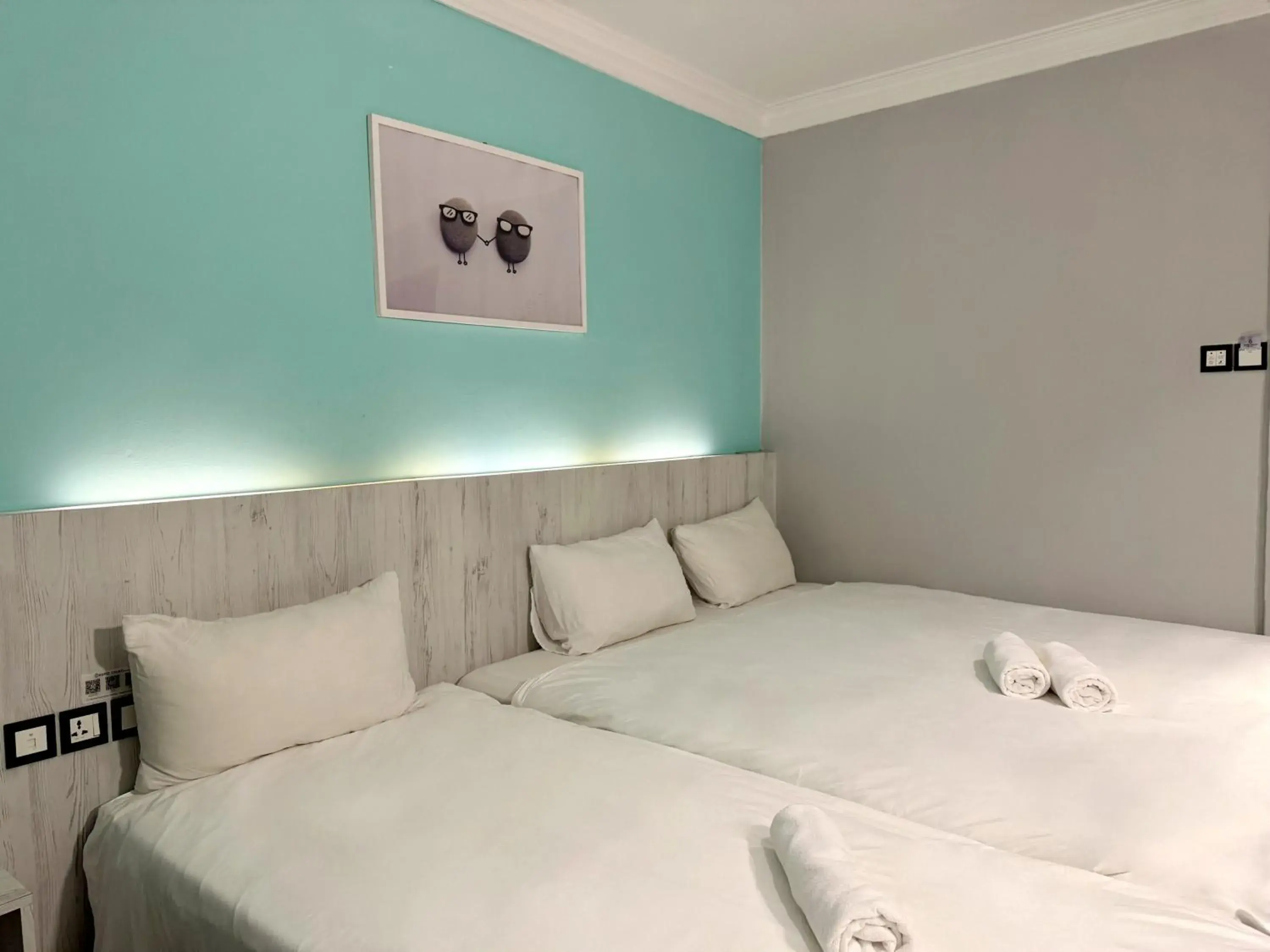 Superior Triple Room in Hotel Calmo Hamilton Superior Triple Room in Hotel Calmo Hamilton
