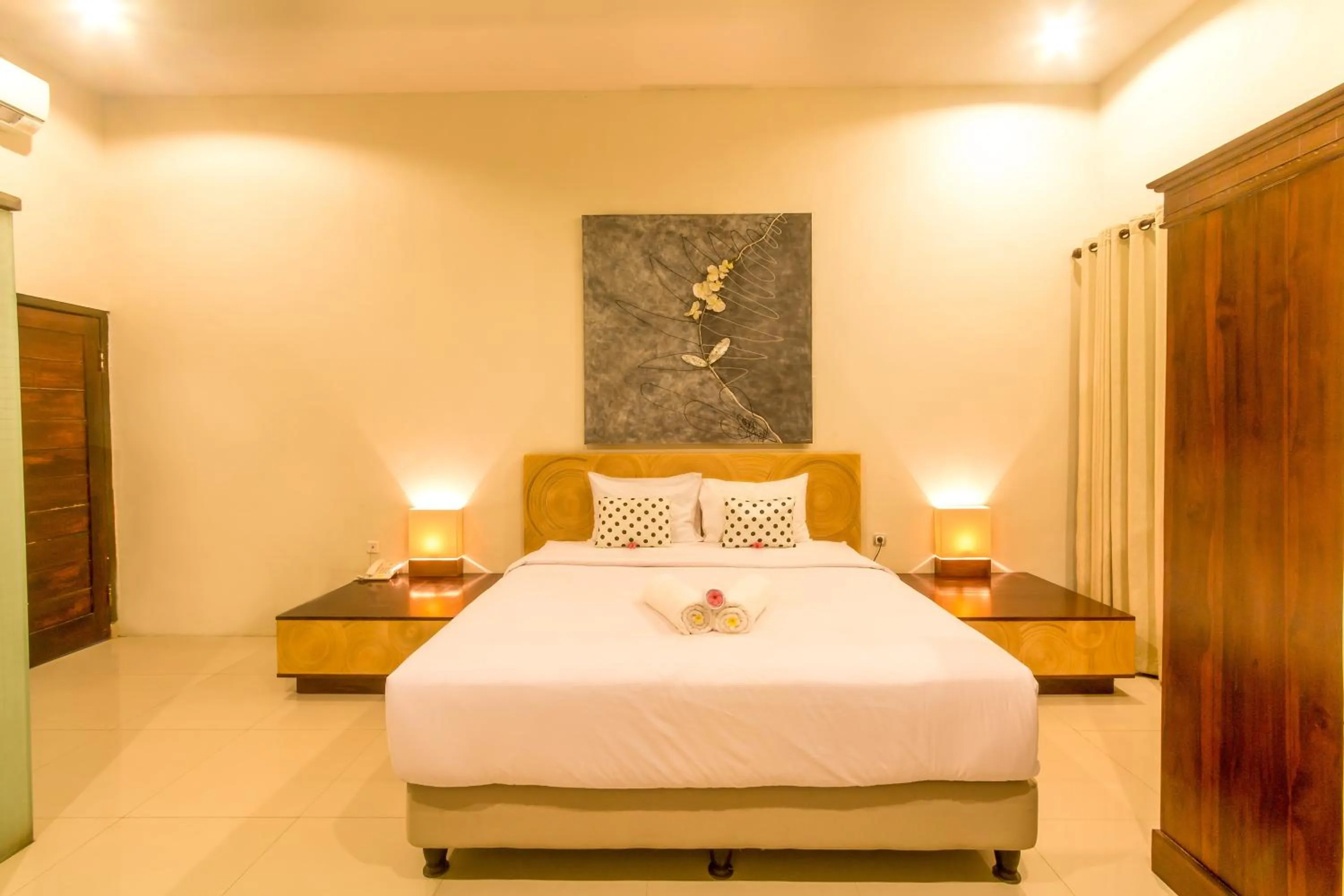 Photo of the whole room, Bed in JM Hotel Kuta Lombok