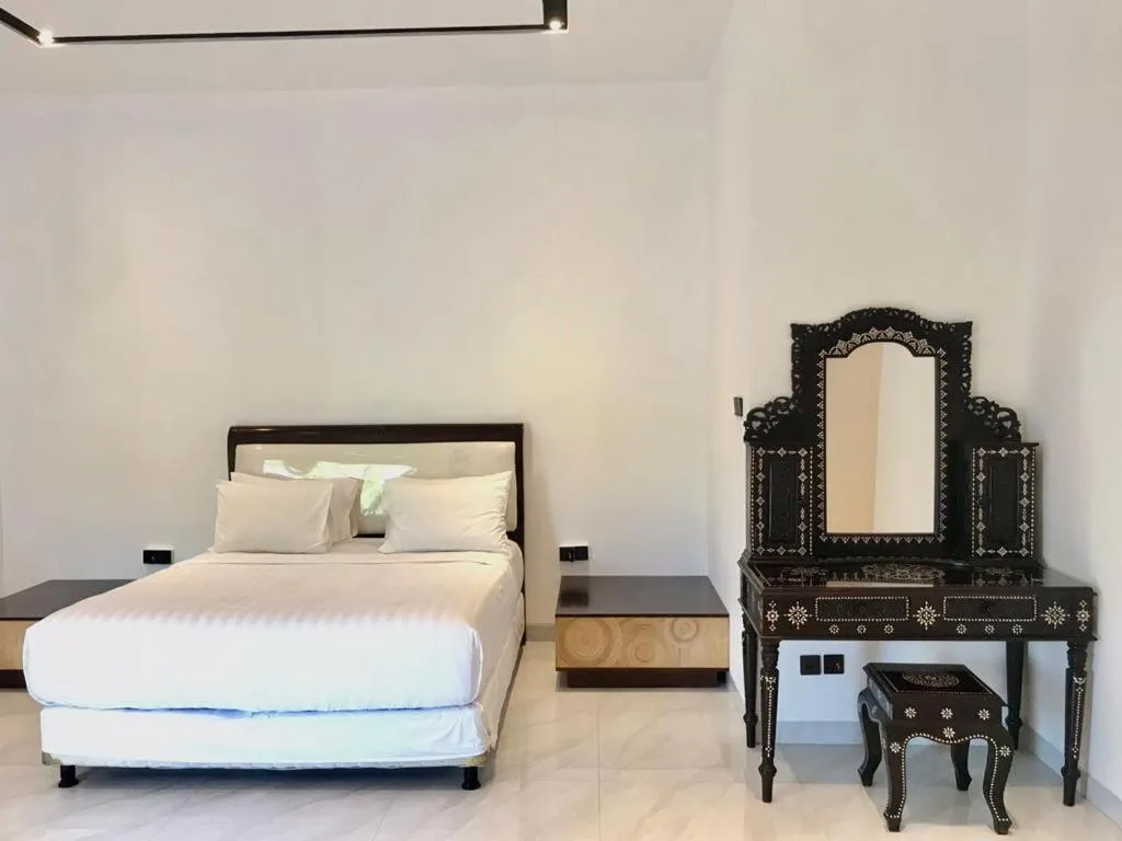 Photo of the whole room, Bed in JM Hotel Kuta Lombok