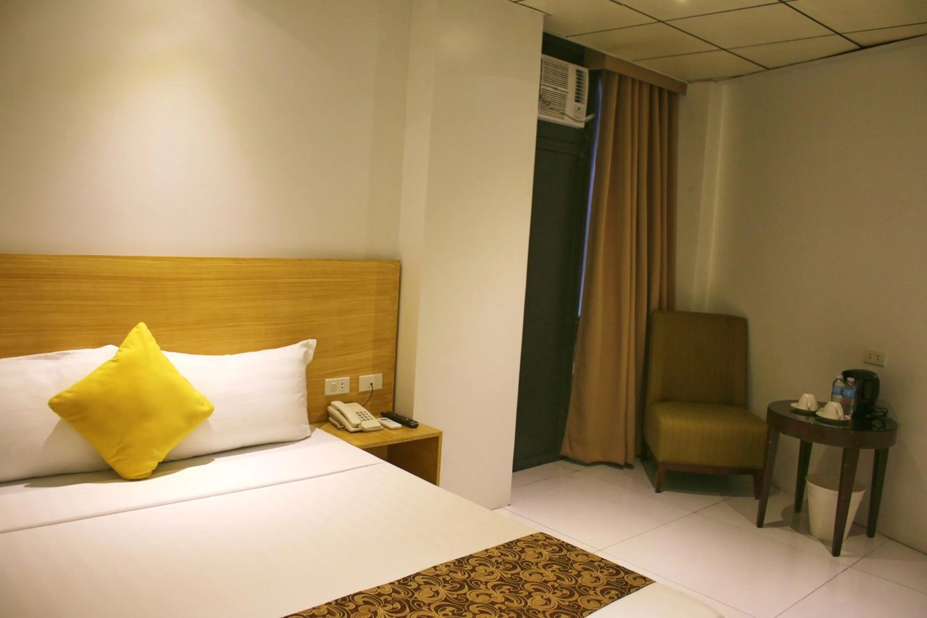 Bed in LuxeLite Suites Pasay