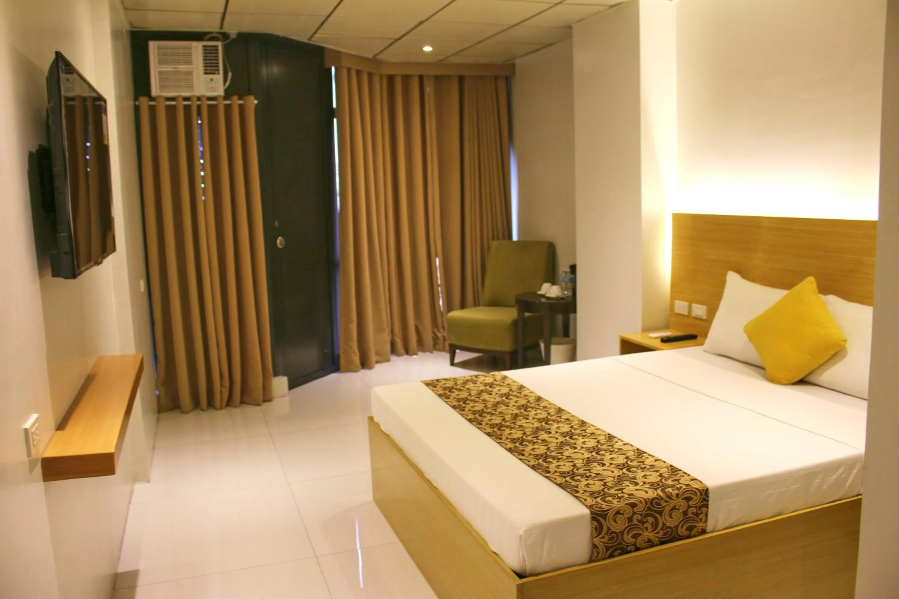 Bed in LuxeLite Suites Pasay
