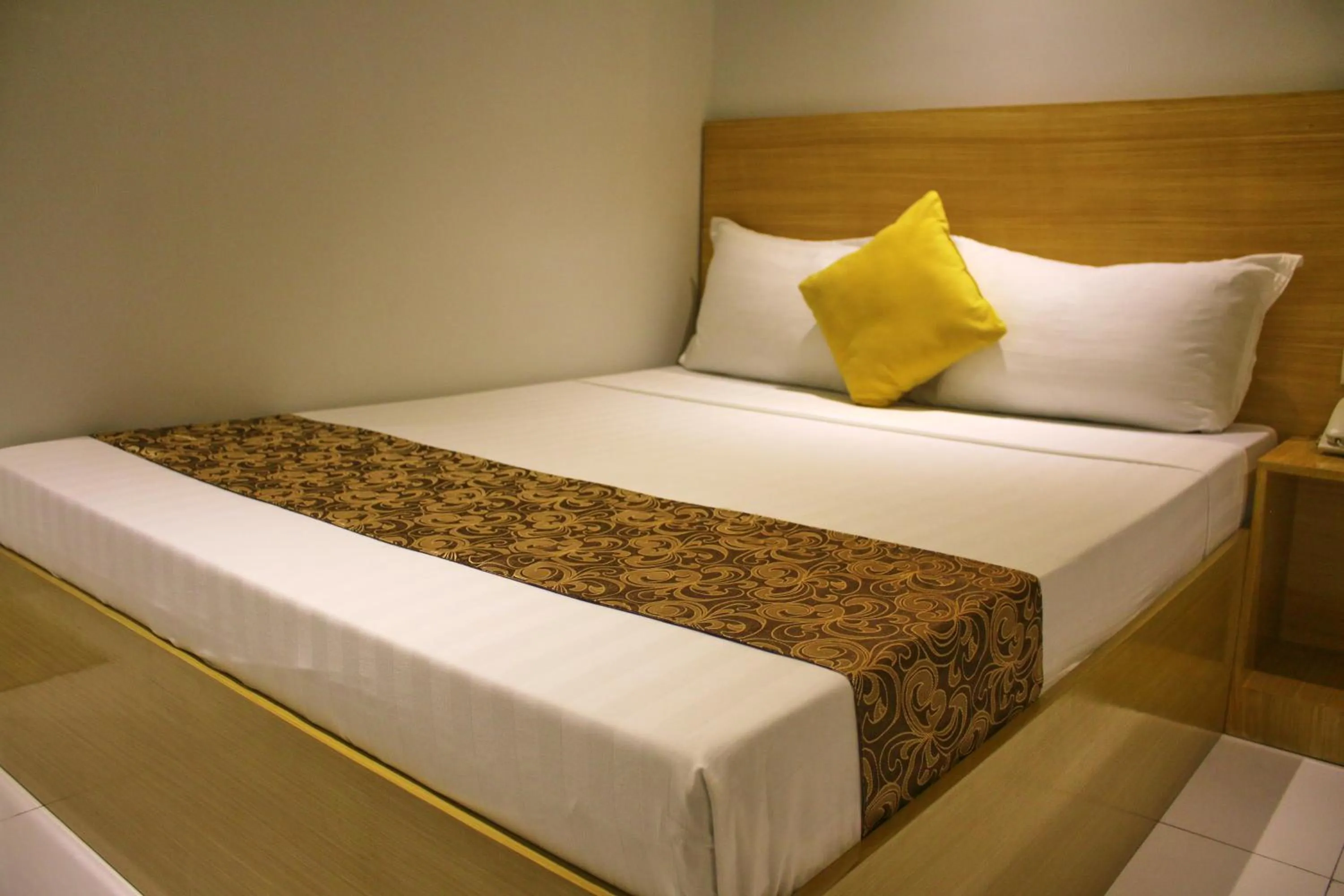 Bed in LuxeLite Suites Pasay