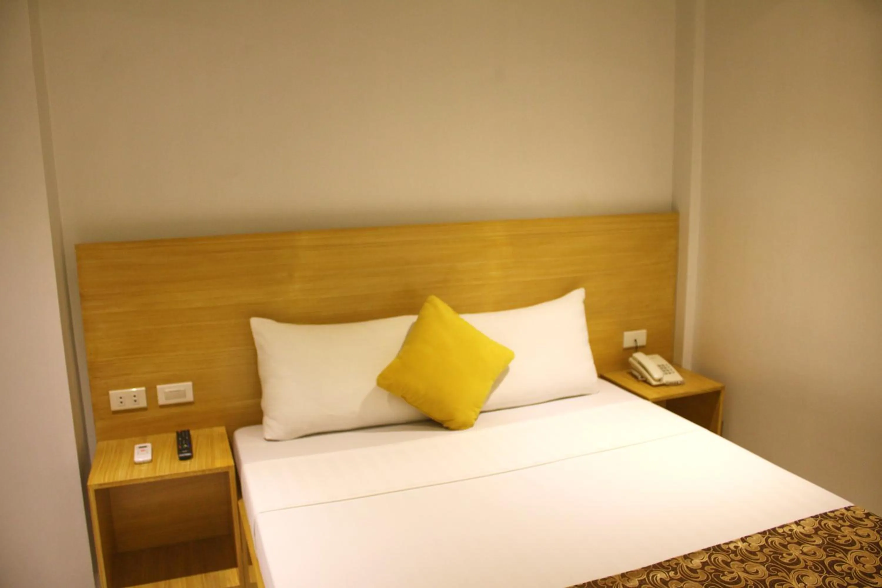 Bed in LuxeLite Suites Pasay