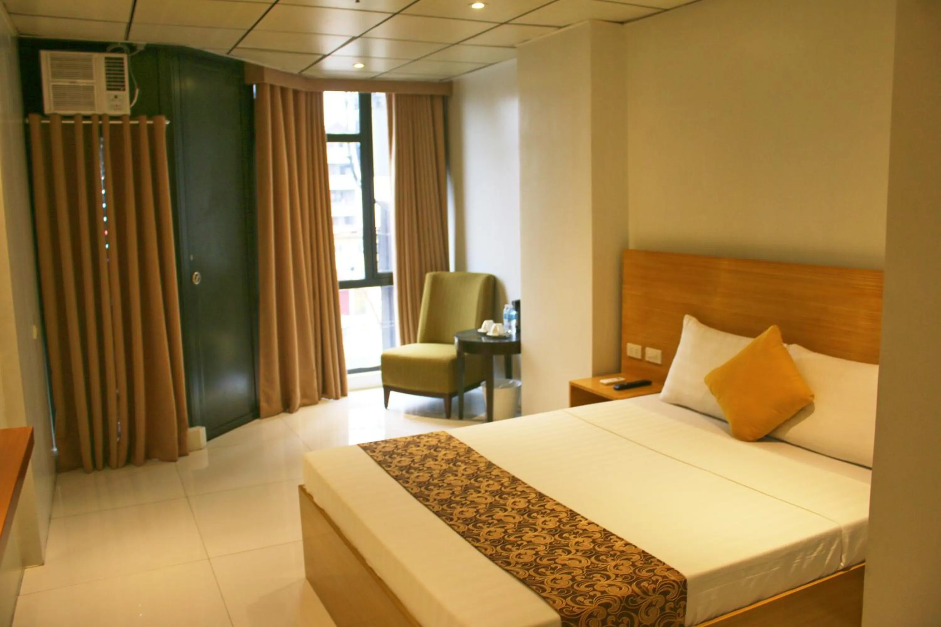 Bed in LuxeLite Suites Pasay