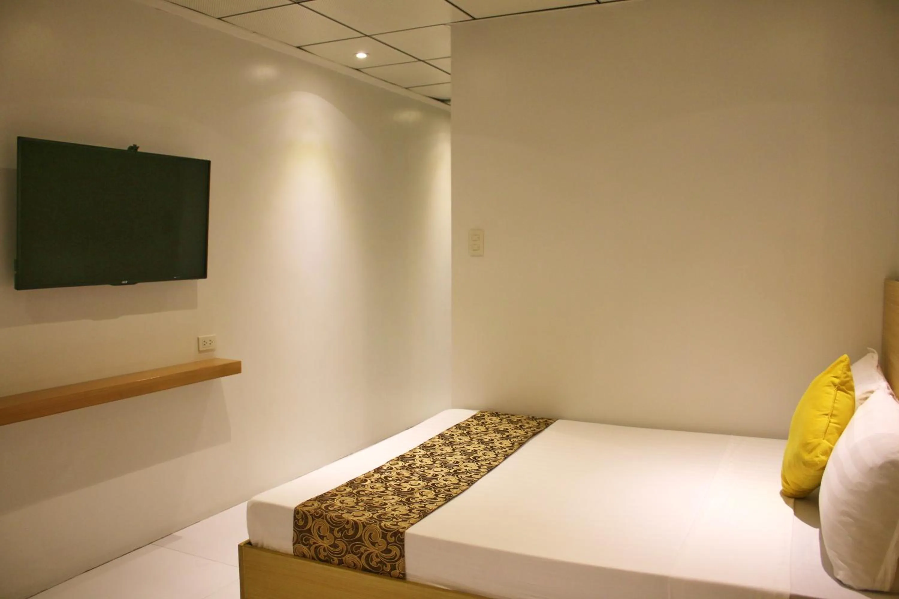 Bed in LuxeLite Suites Pasay