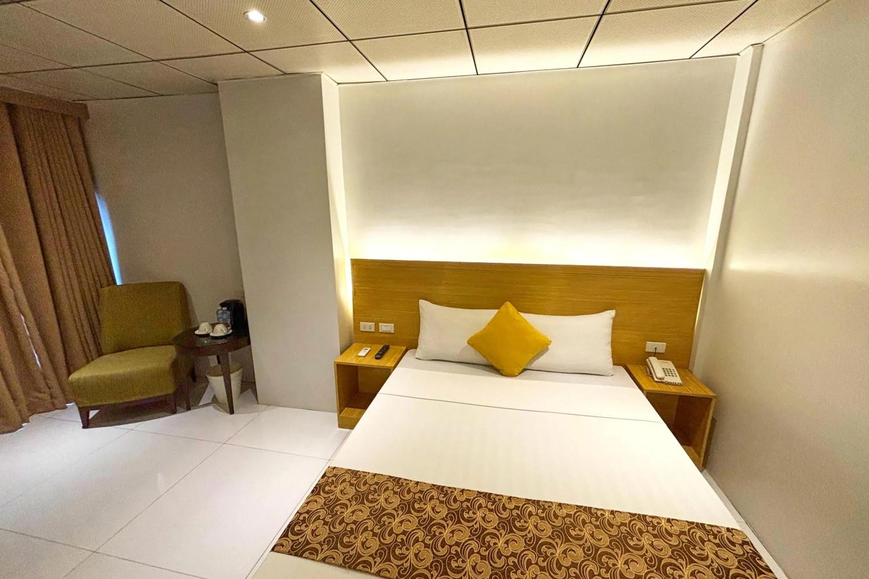 Bed in LuxeLite Suites Pasay