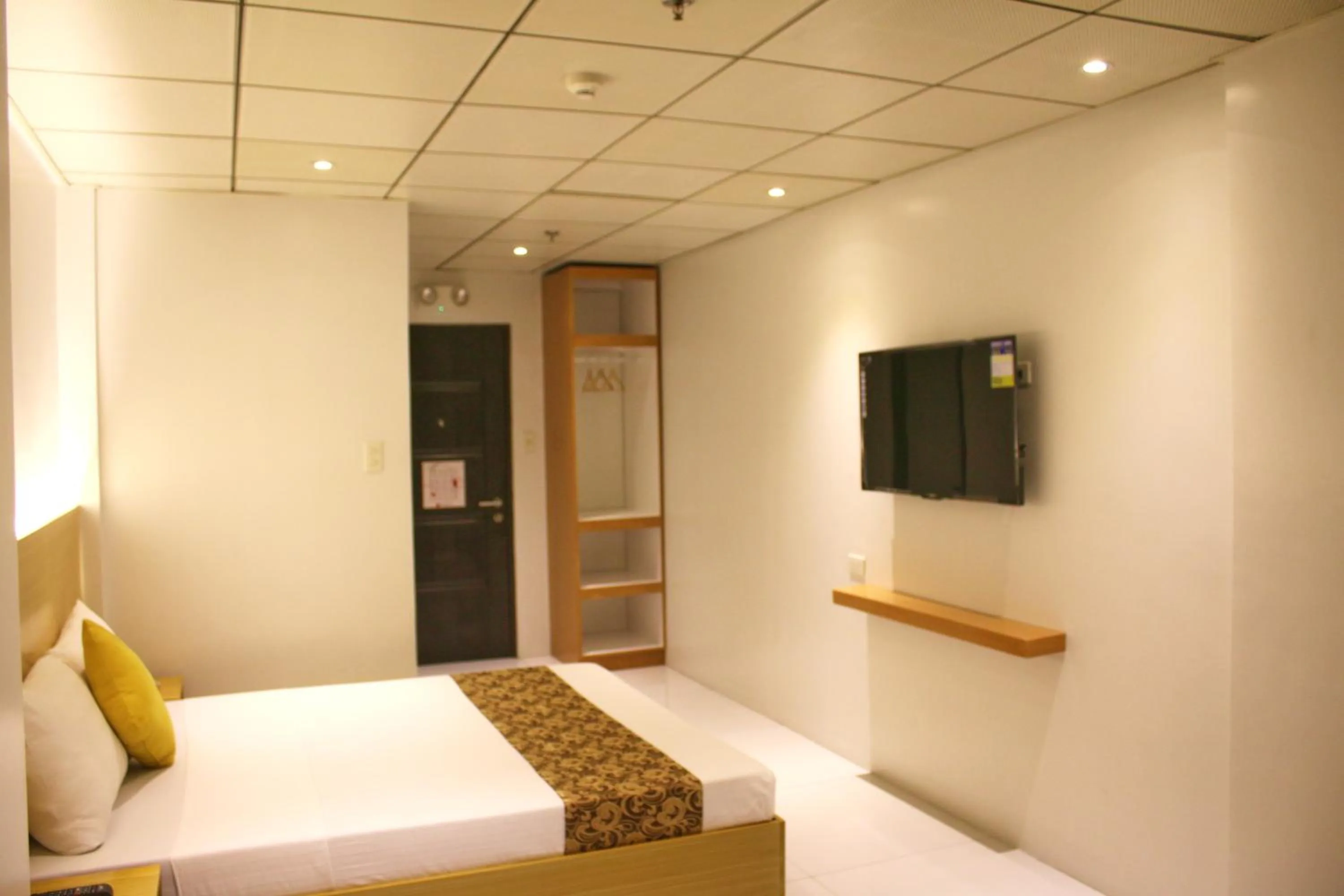 Bed in LuxeLite Suites Pasay