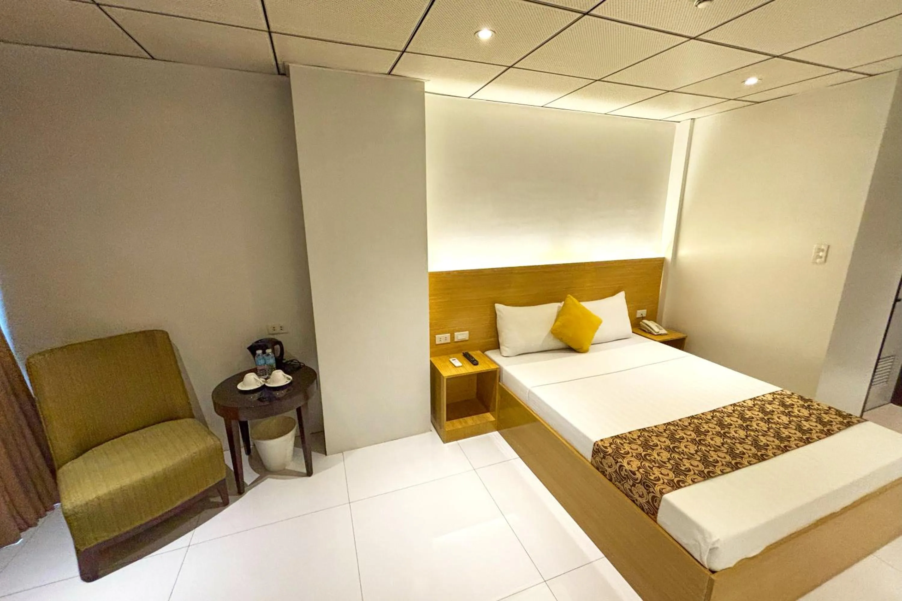 Bed in LuxeLite Suites Pasay