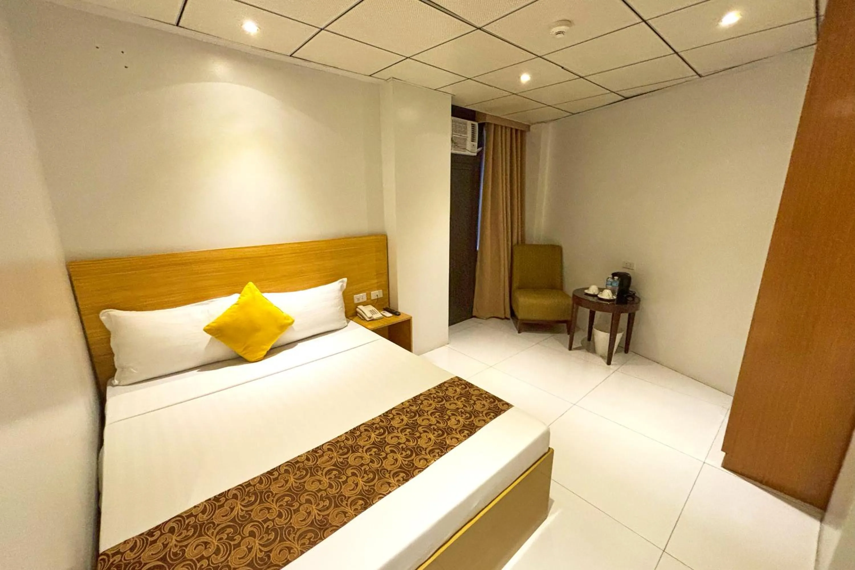 Bed in LuxeLite Suites Pasay