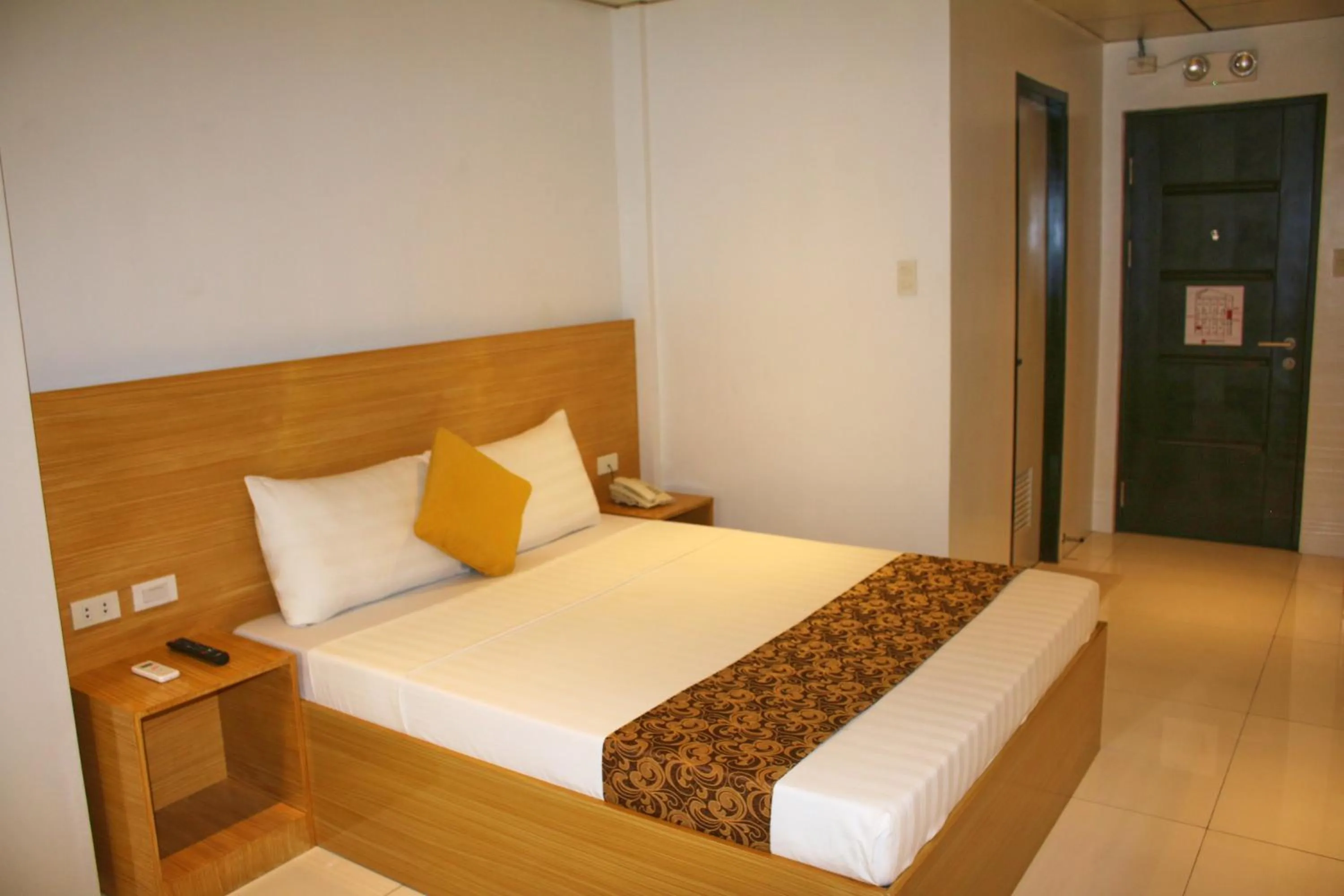 Bed in LuxeLite Suites Pasay