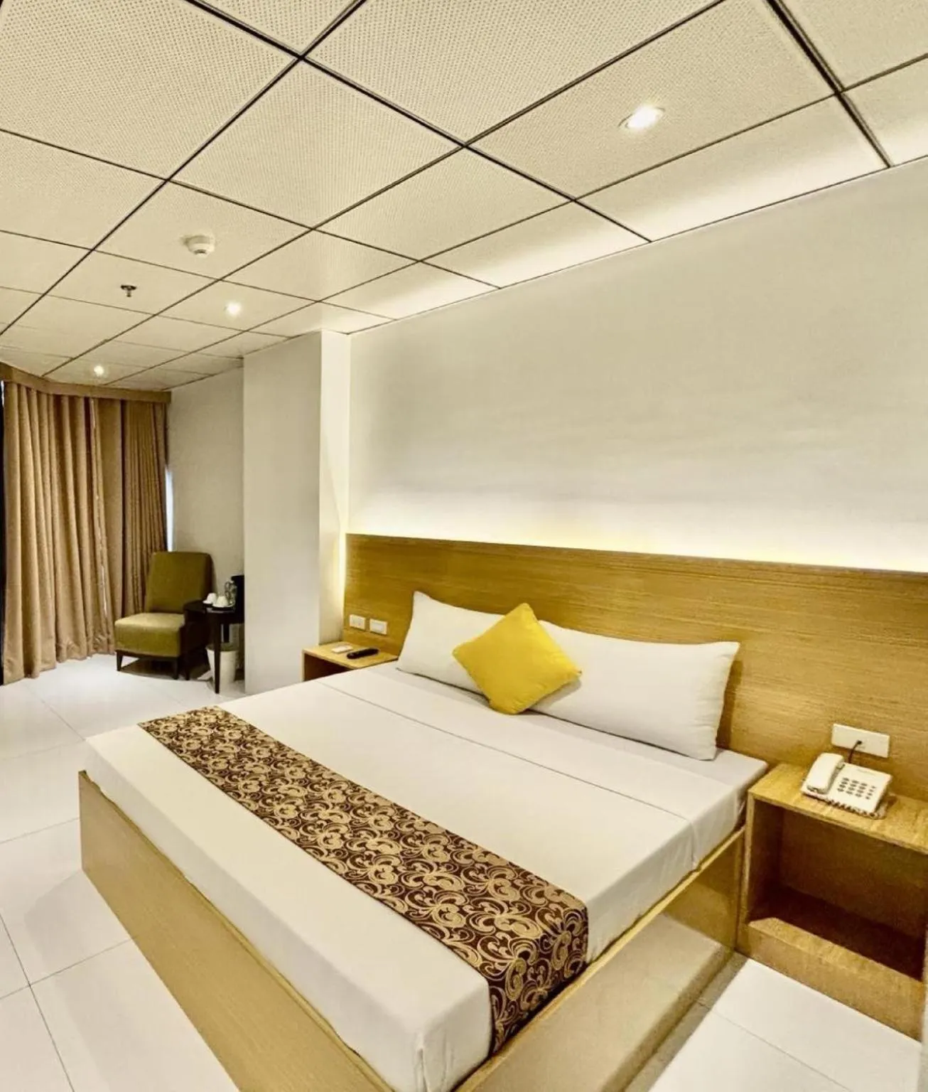 Bed in LuxeLite Suites Pasay