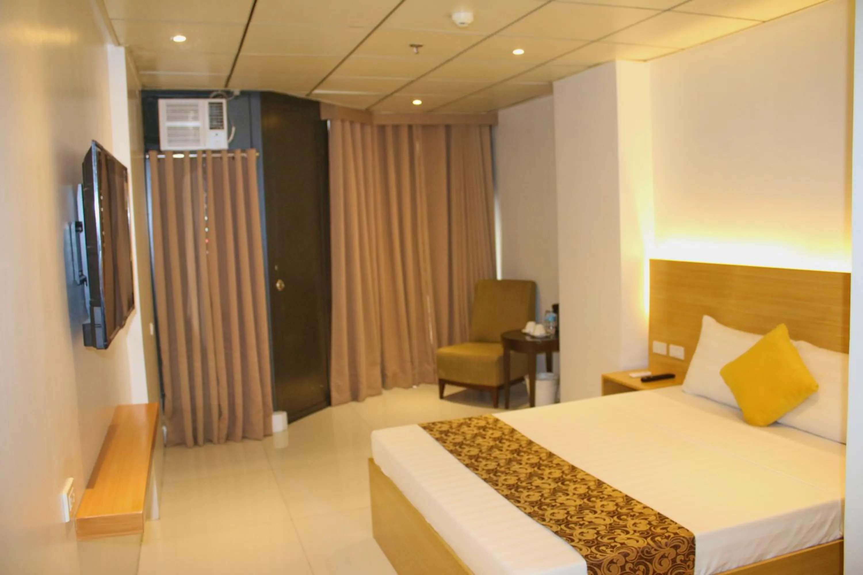Bed in LuxeLite Suites Pasay