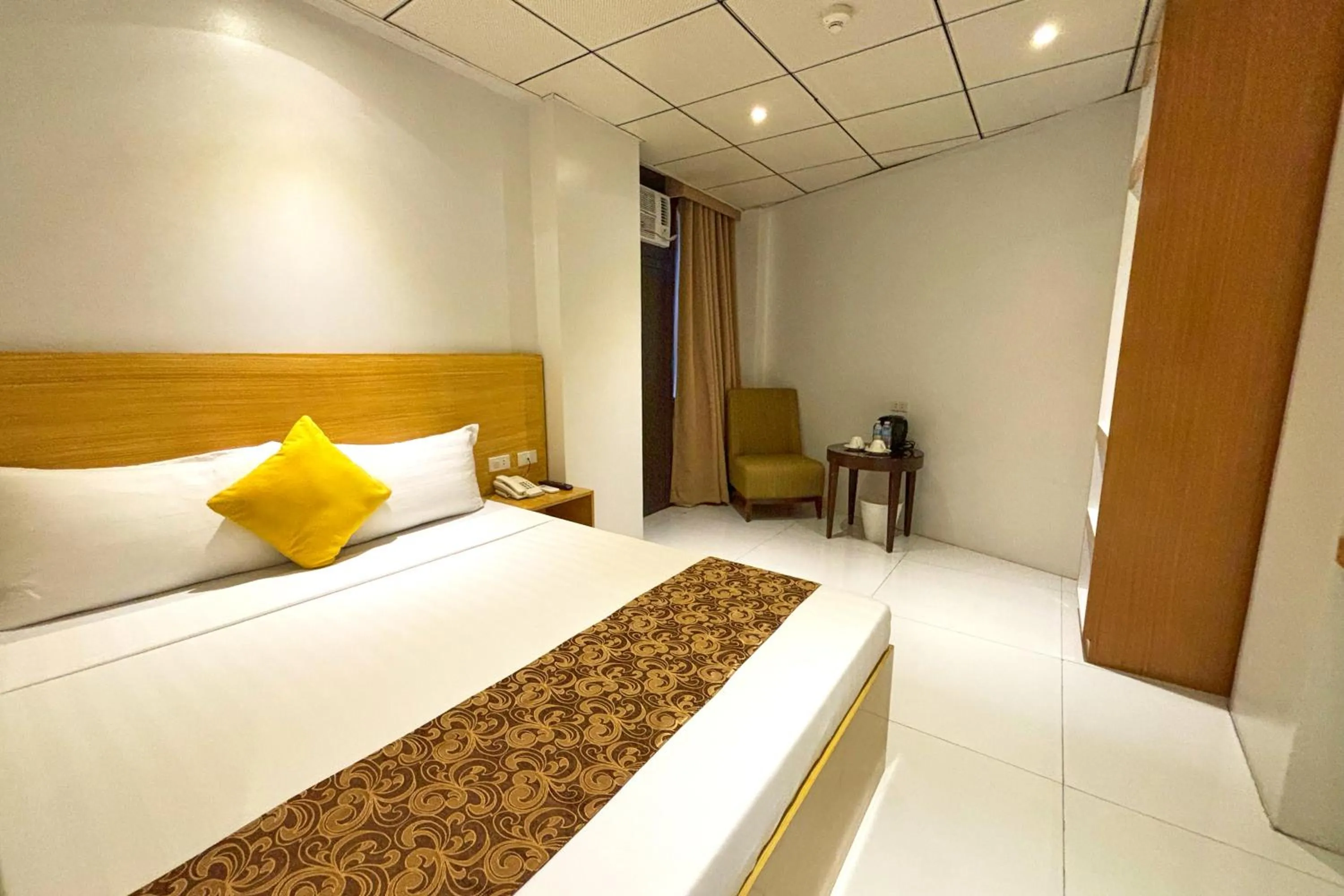 Bed in LuxeLite Suites Pasay