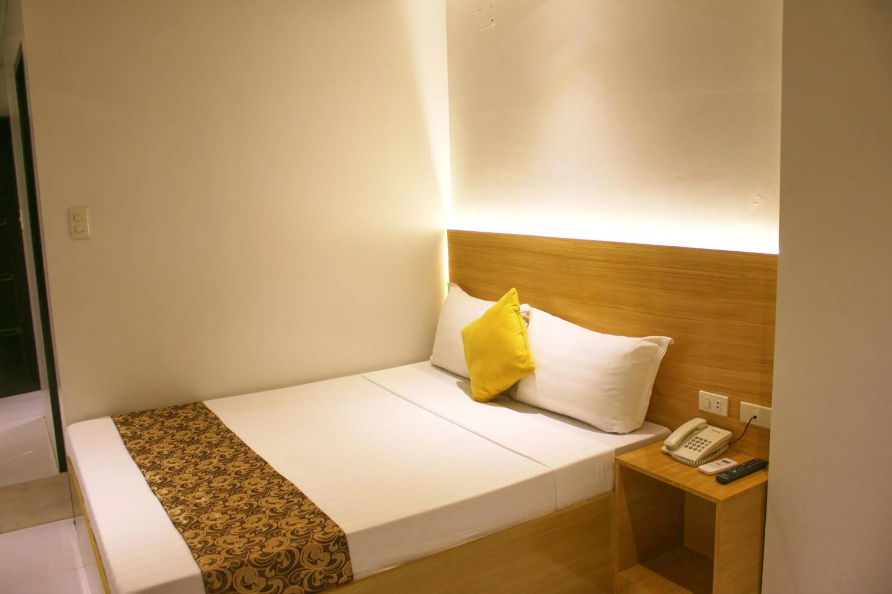 Bed in LuxeLite Suites Pasay