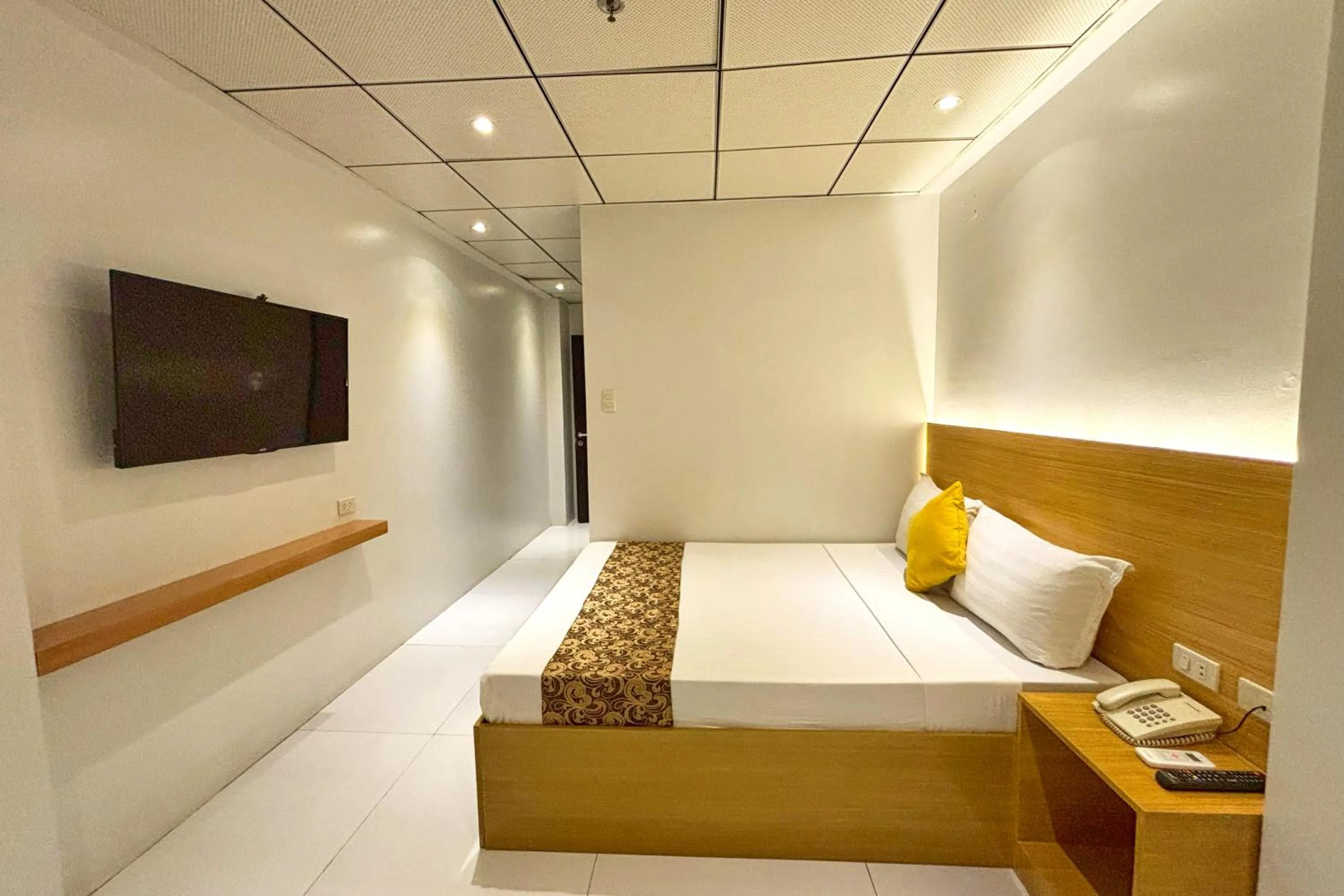 Bed in LuxeLite Suites Pasay