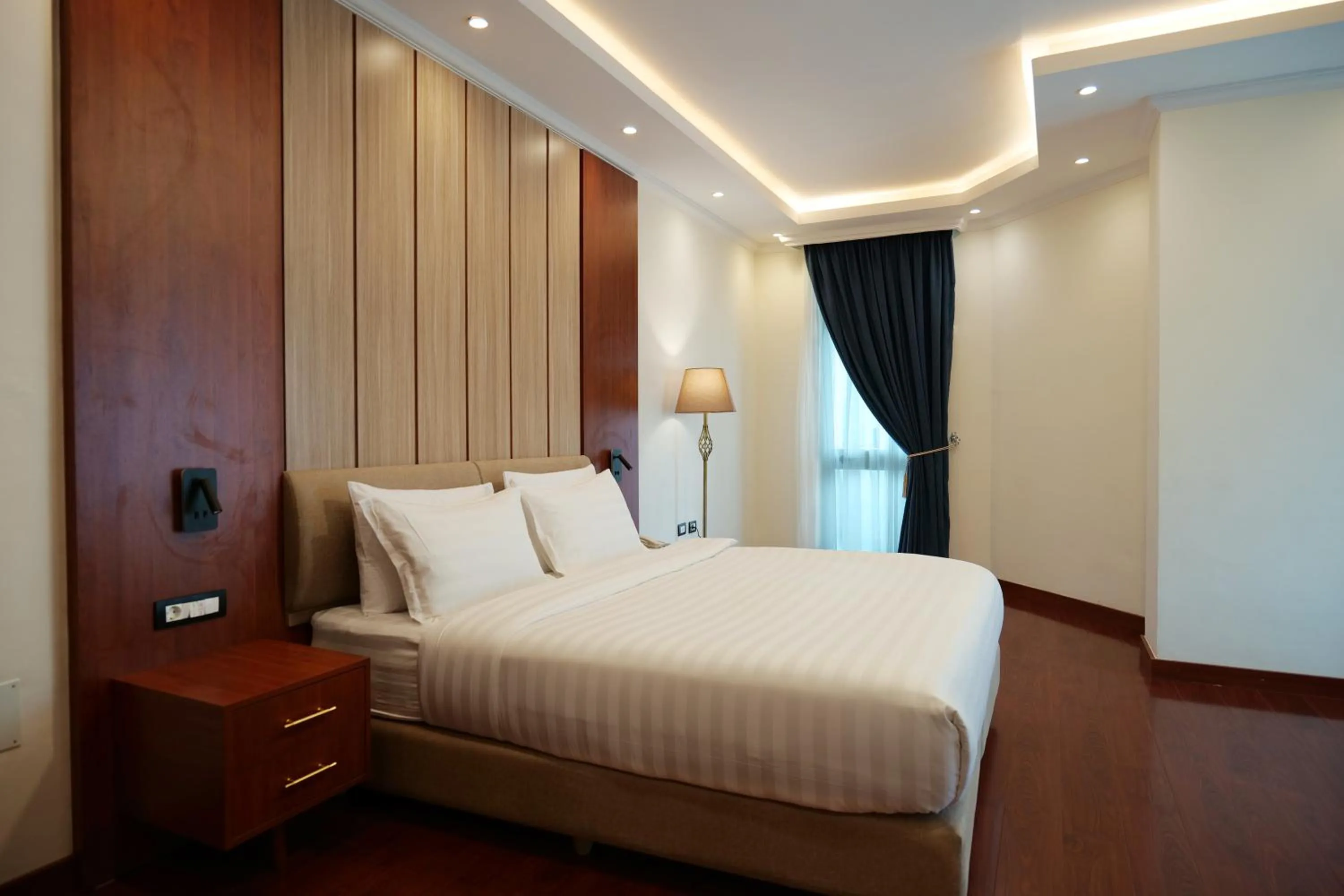 Bed in Crescent International Hotel