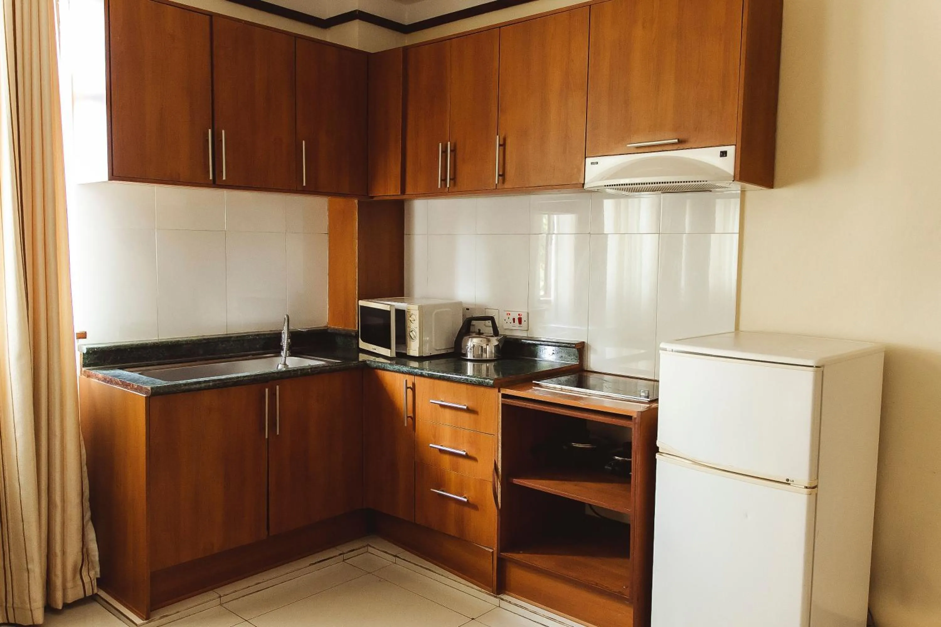 Kitchen or kitchenette in Highlands Apartment