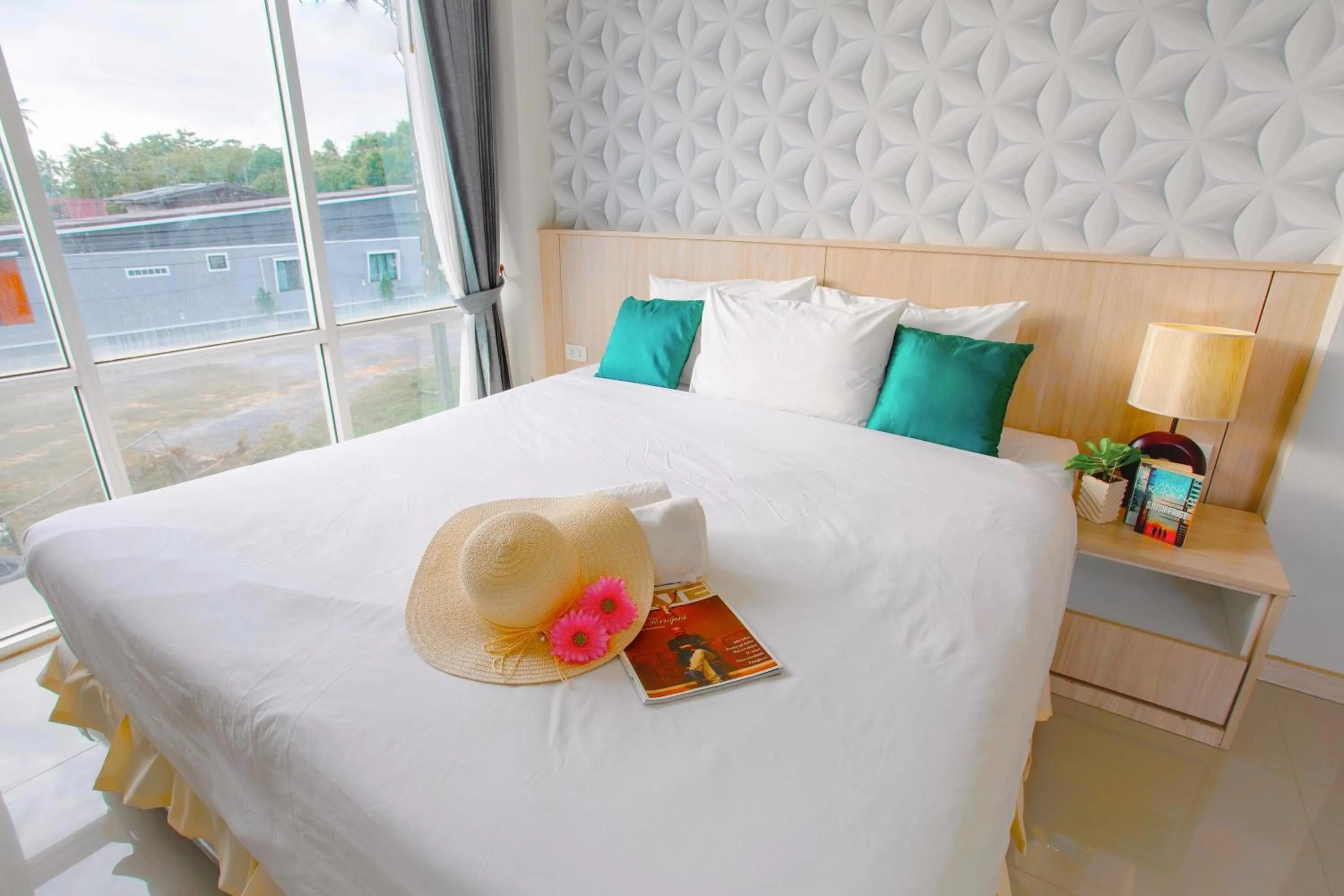 Bed in The Wings Boutique Hotels Krabi Ko Lanta