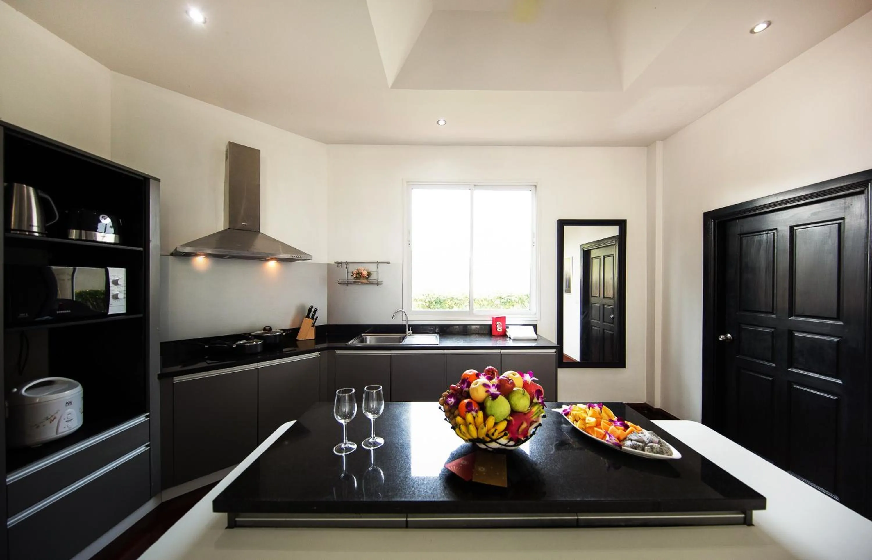 Kitchen or kitchenette in Paradise Pool Villa Pattaya in Tropicana Village