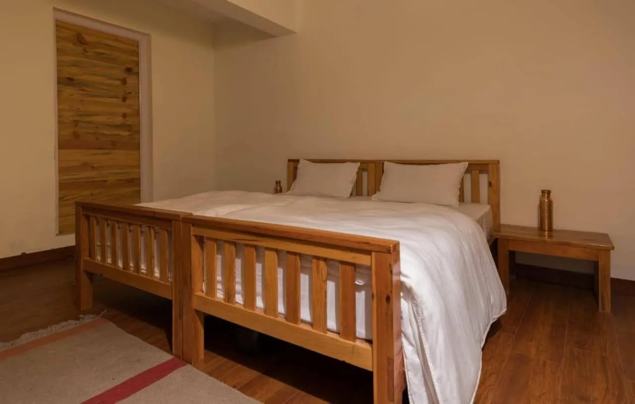 Bed in Kasar Rainbow Yoga Retreat