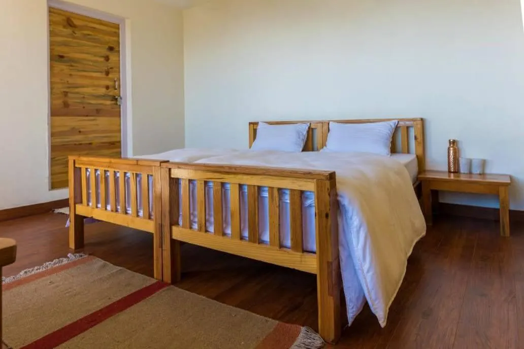 Bed in Kasar Rainbow Yoga Retreat