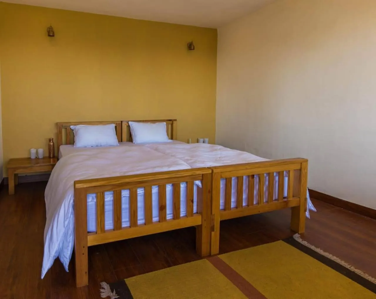 Bed in Kasar Rainbow Yoga Retreat