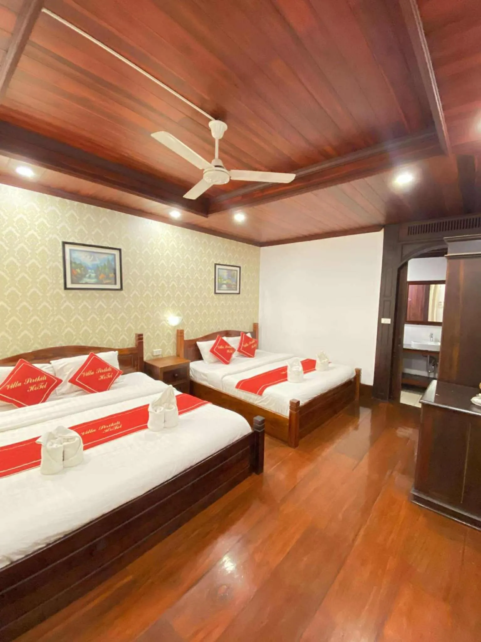 Bed in Villa Sirikili Hotel Luang Prabang