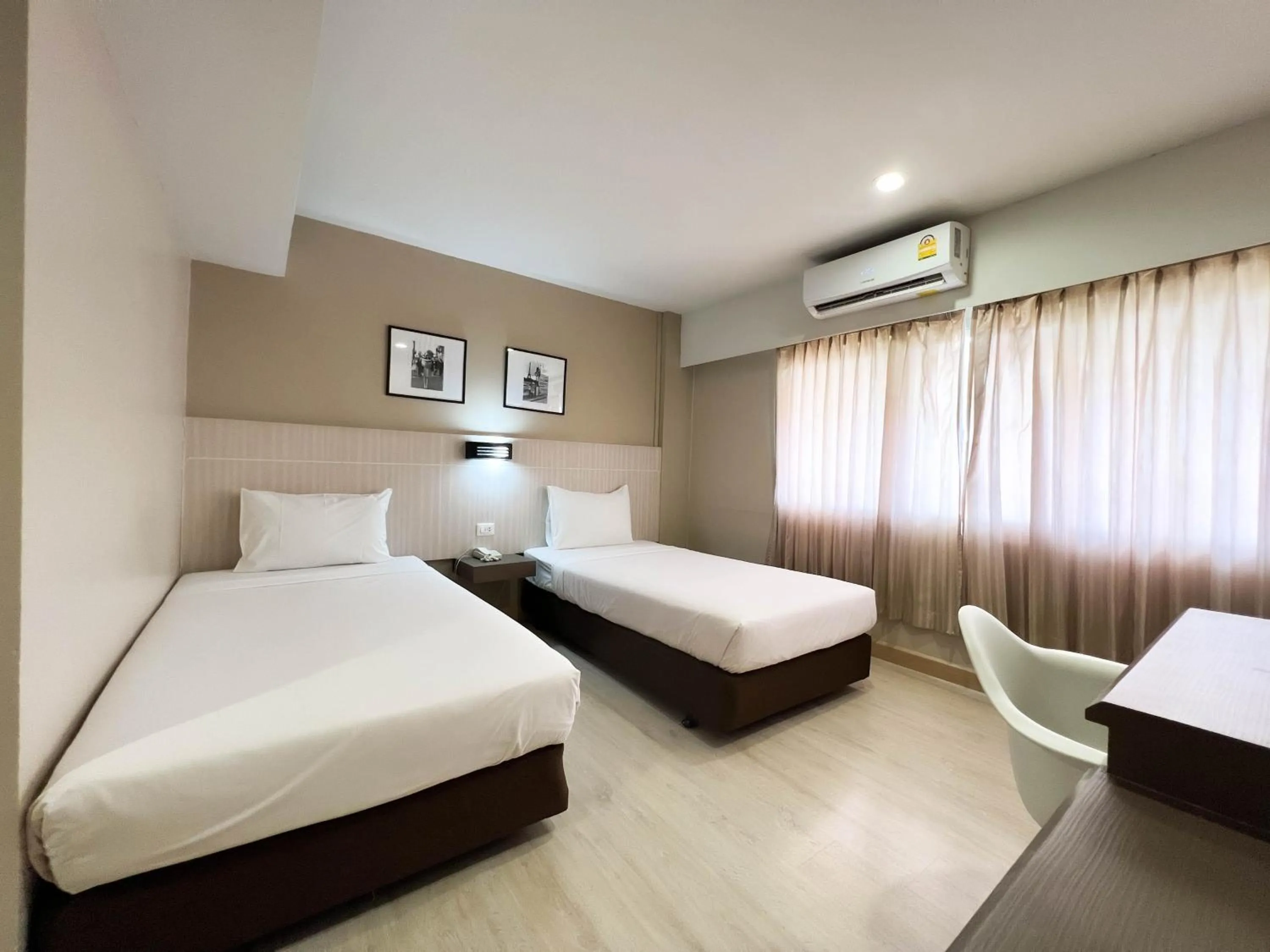 Bed in Srivichai Hotel