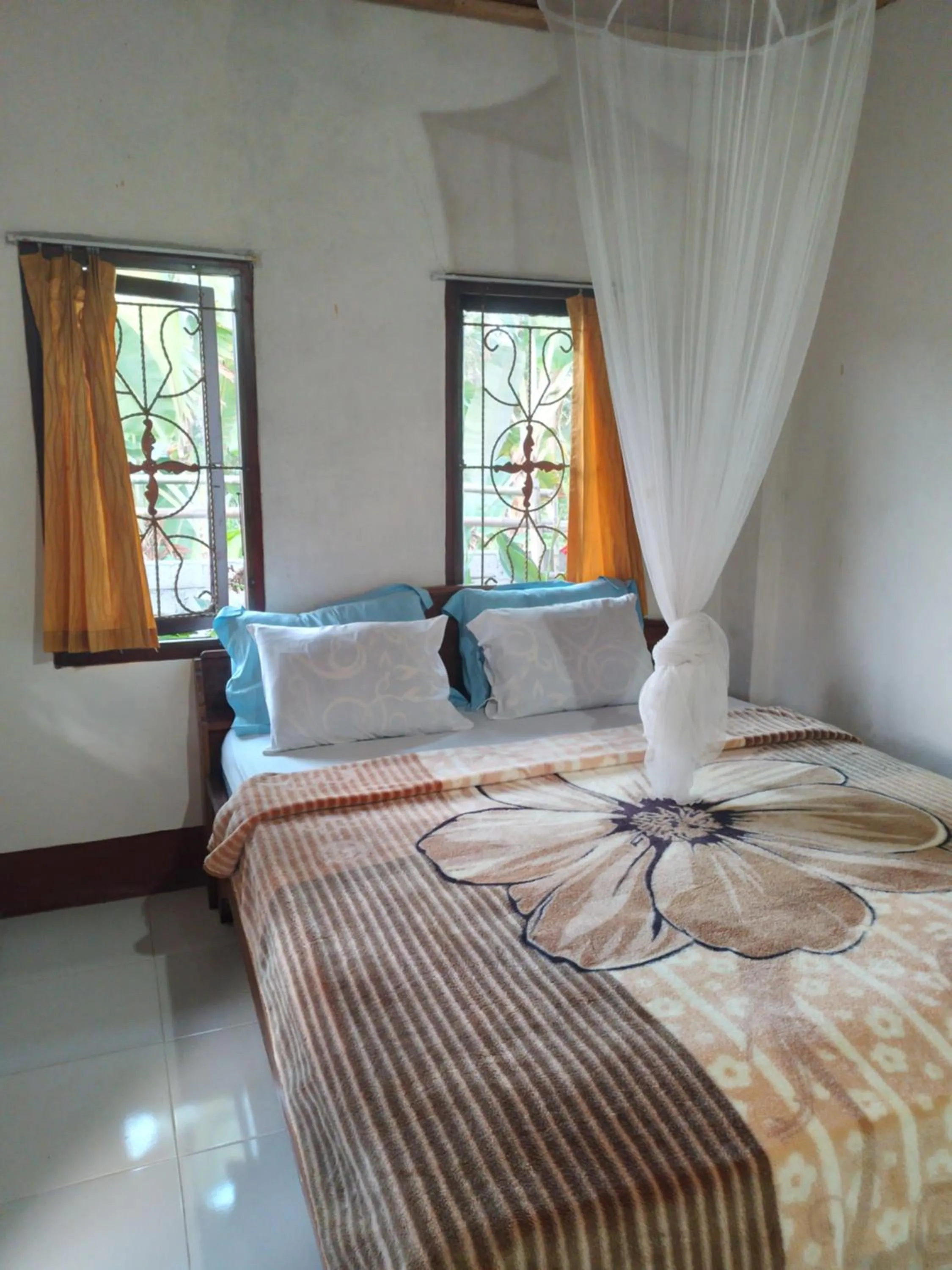 Bed in Kembang Kuning Cottages