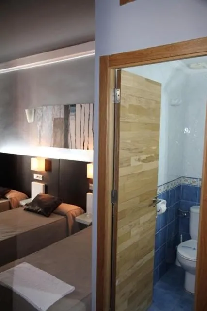 Photo of the whole room, Bed in Hostal Plaza Ruiz