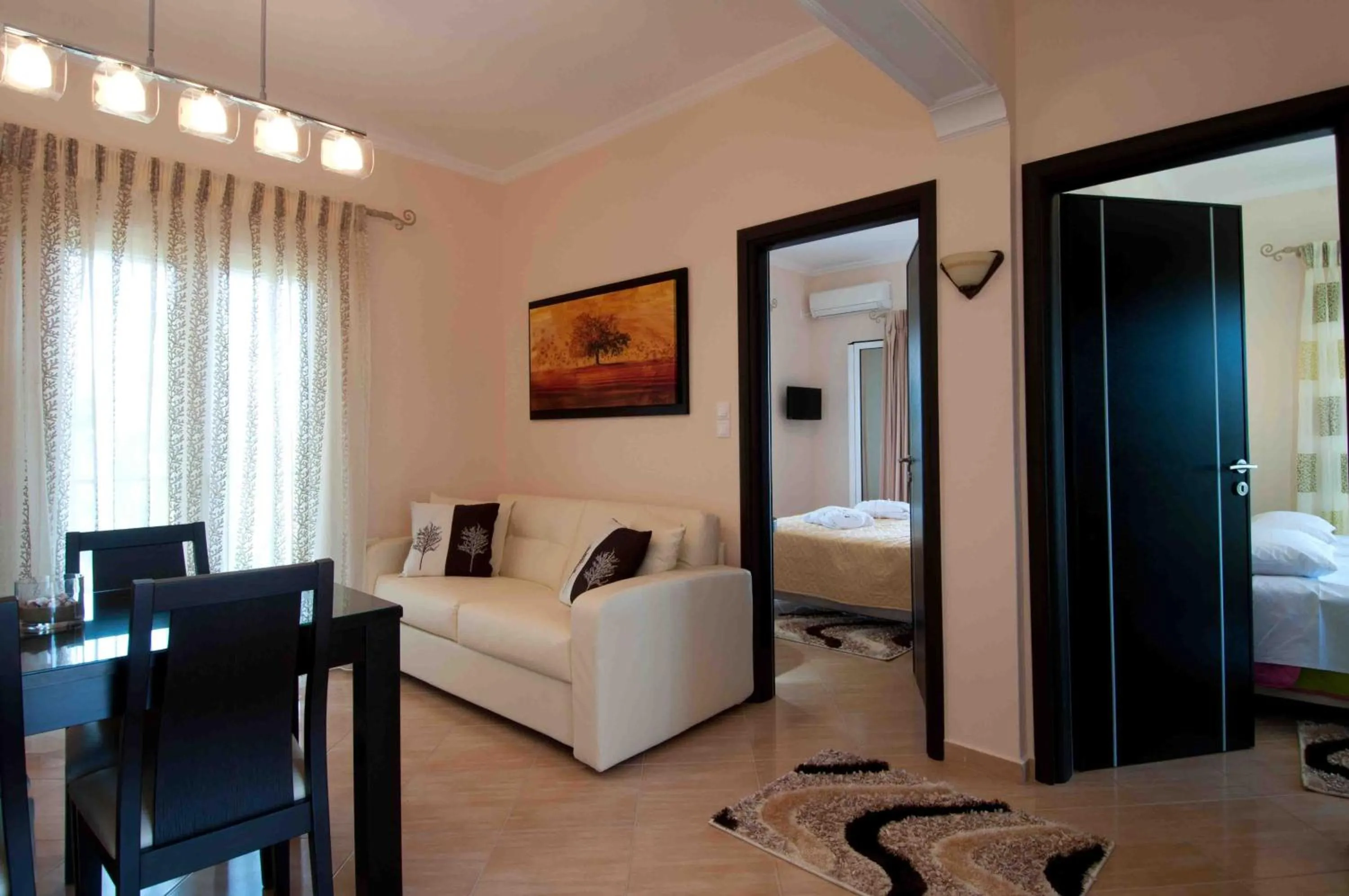 Living room, Bed in Brentanos Apartments - A - View of Paradise