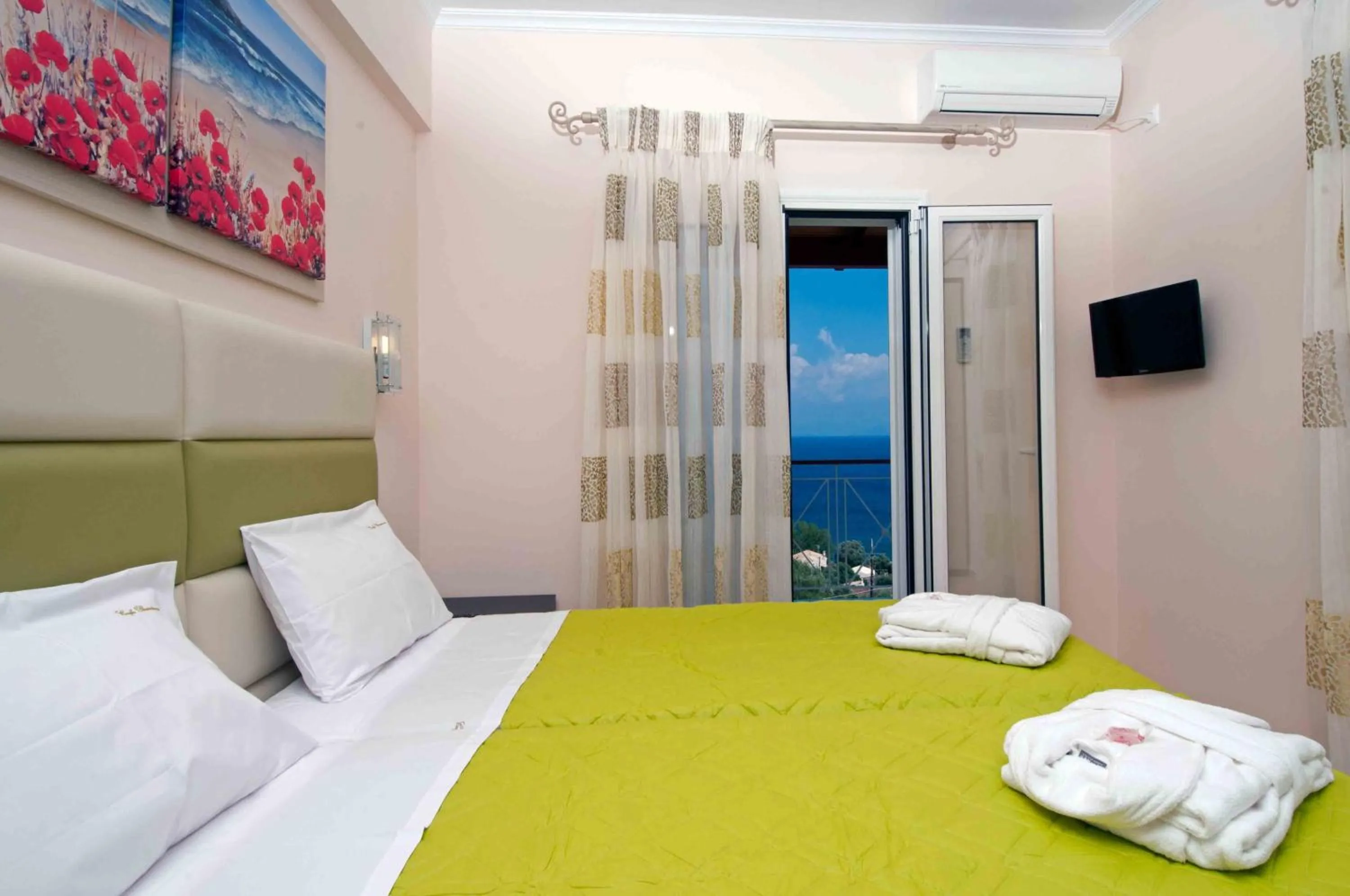 Bed in Brentanos Apartments - A - View of Paradise