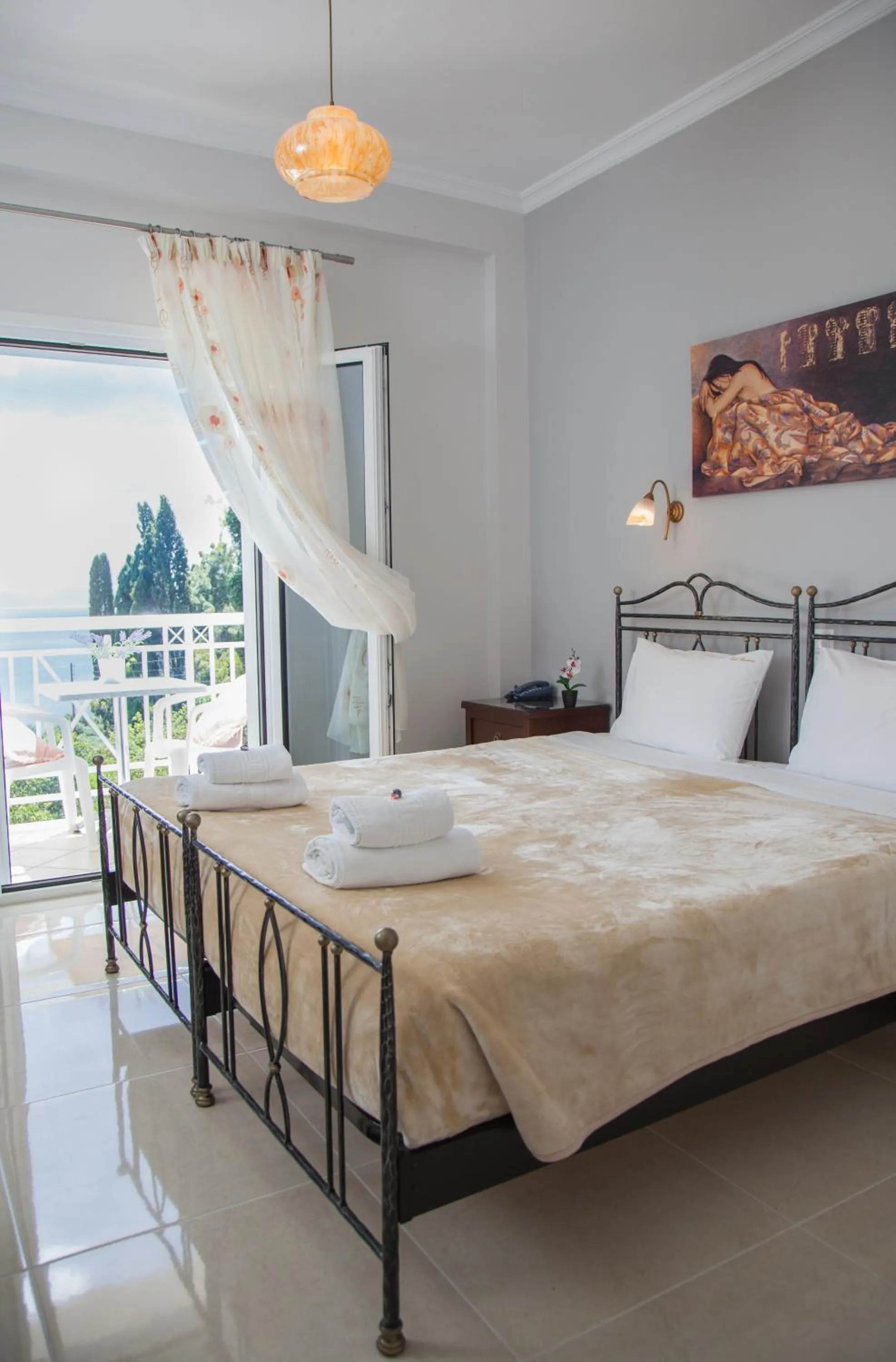 Bed in Brentanos Apartments - A - View of Paradise