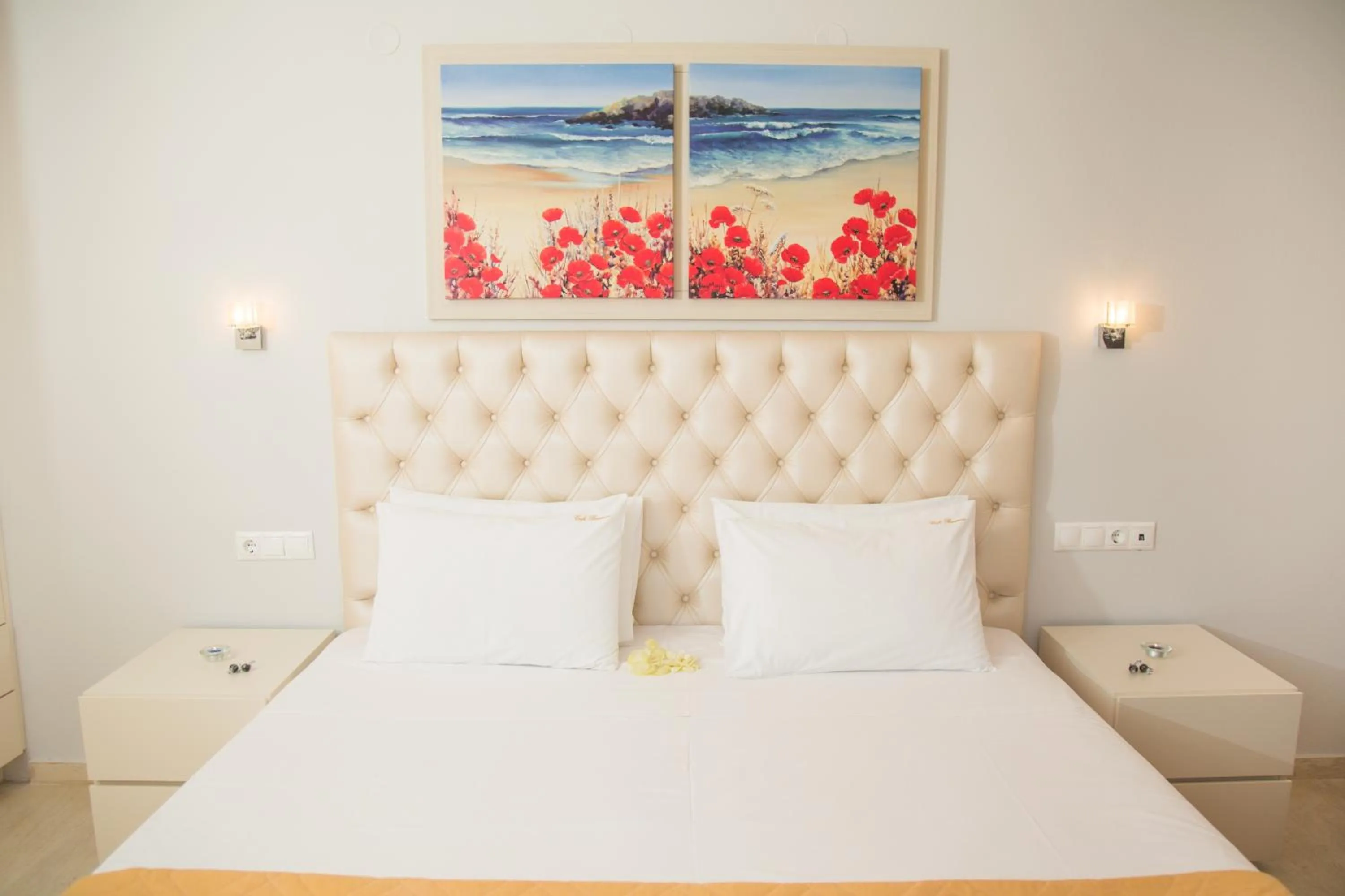 Bed in Brentanos Apartments - A - View of Paradise