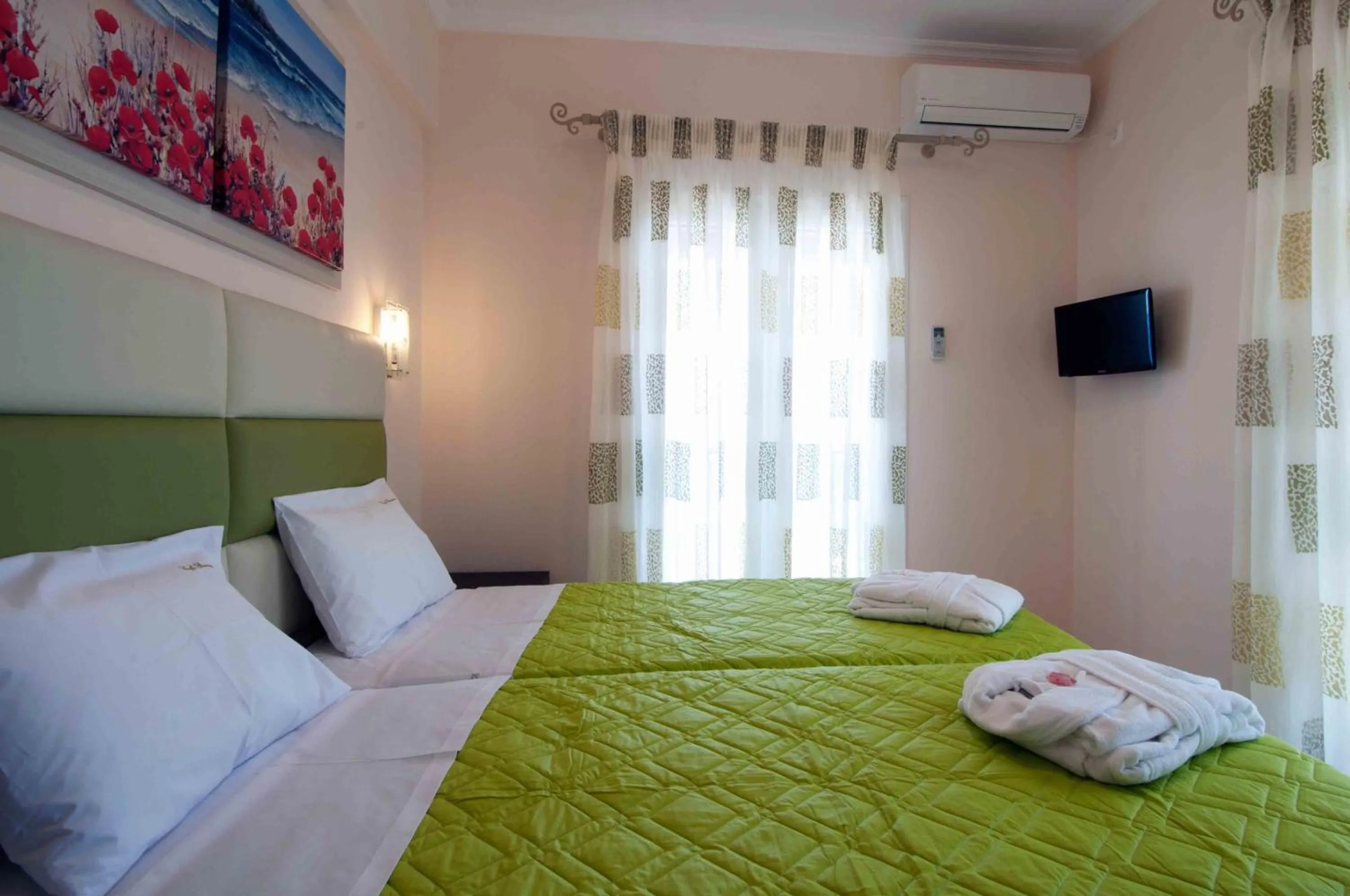 Photo of the whole room, Bed in Brentanos Apartments - A - View of Paradise