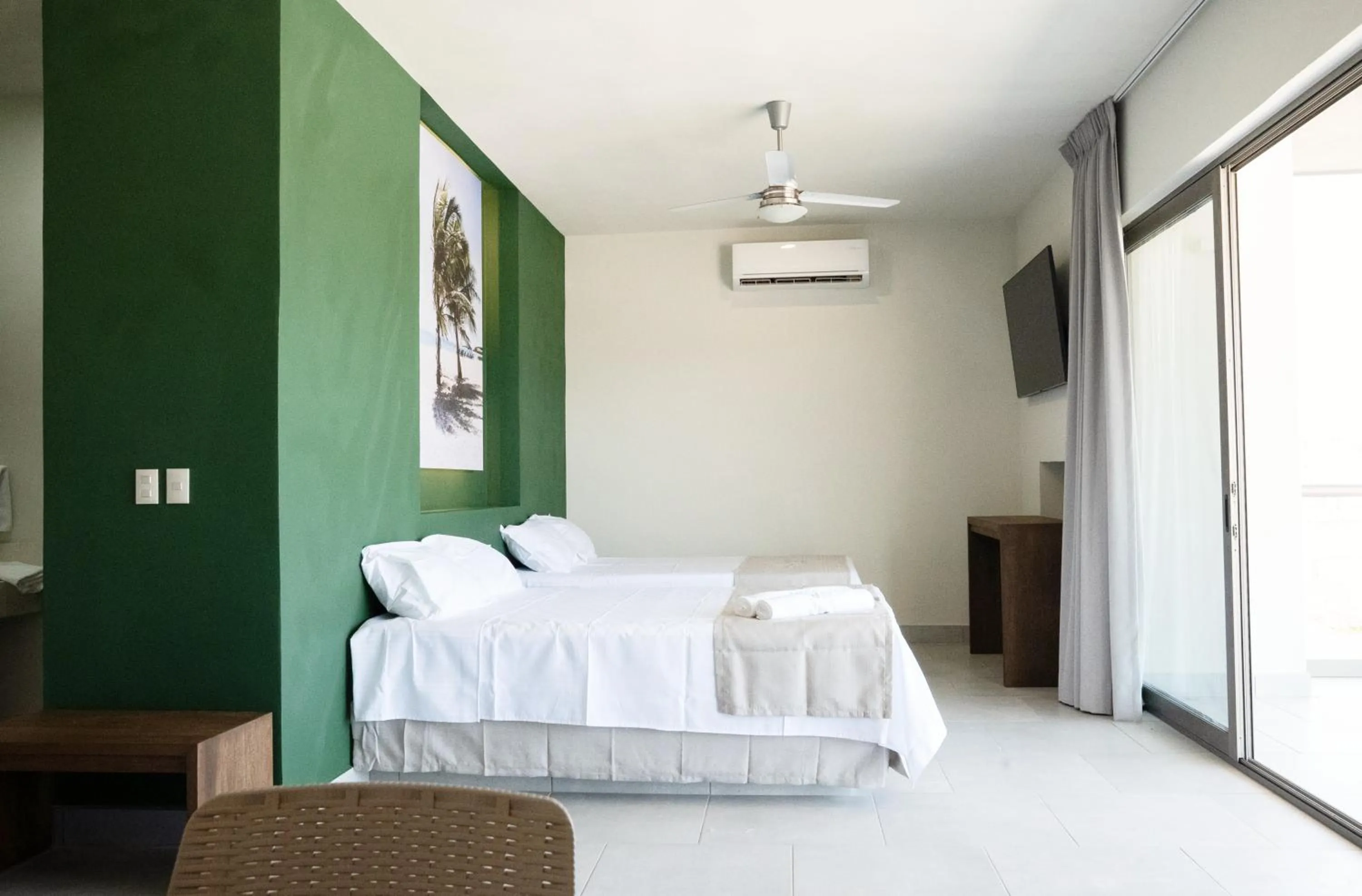 Bed in Avenir Armonia Suites