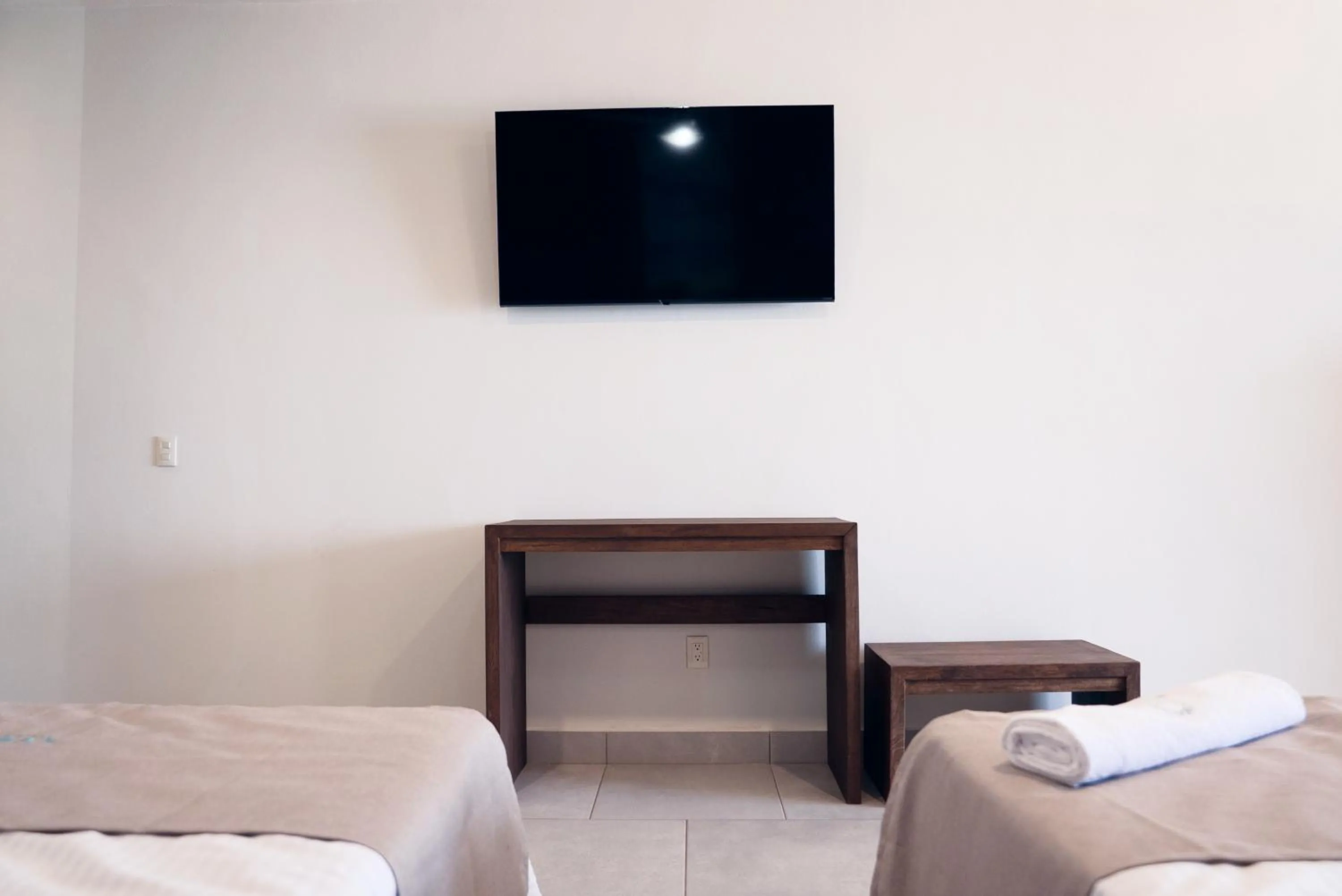 Bed in Avenir Armonia Suites