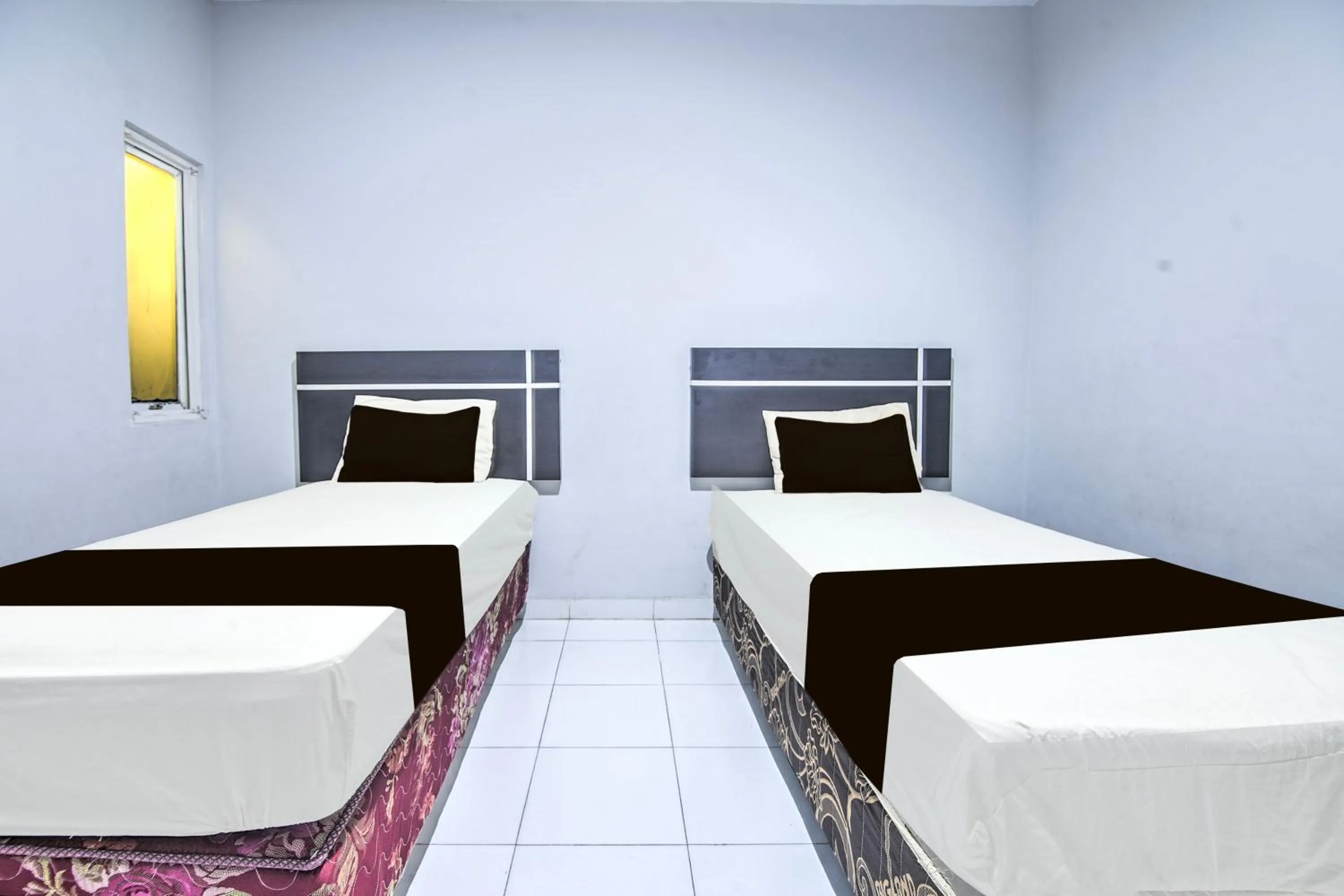 Bedroom, Bed in Hotel O Makassar near Mall Panakukang formerly Hotel Lucky Inn Makassar