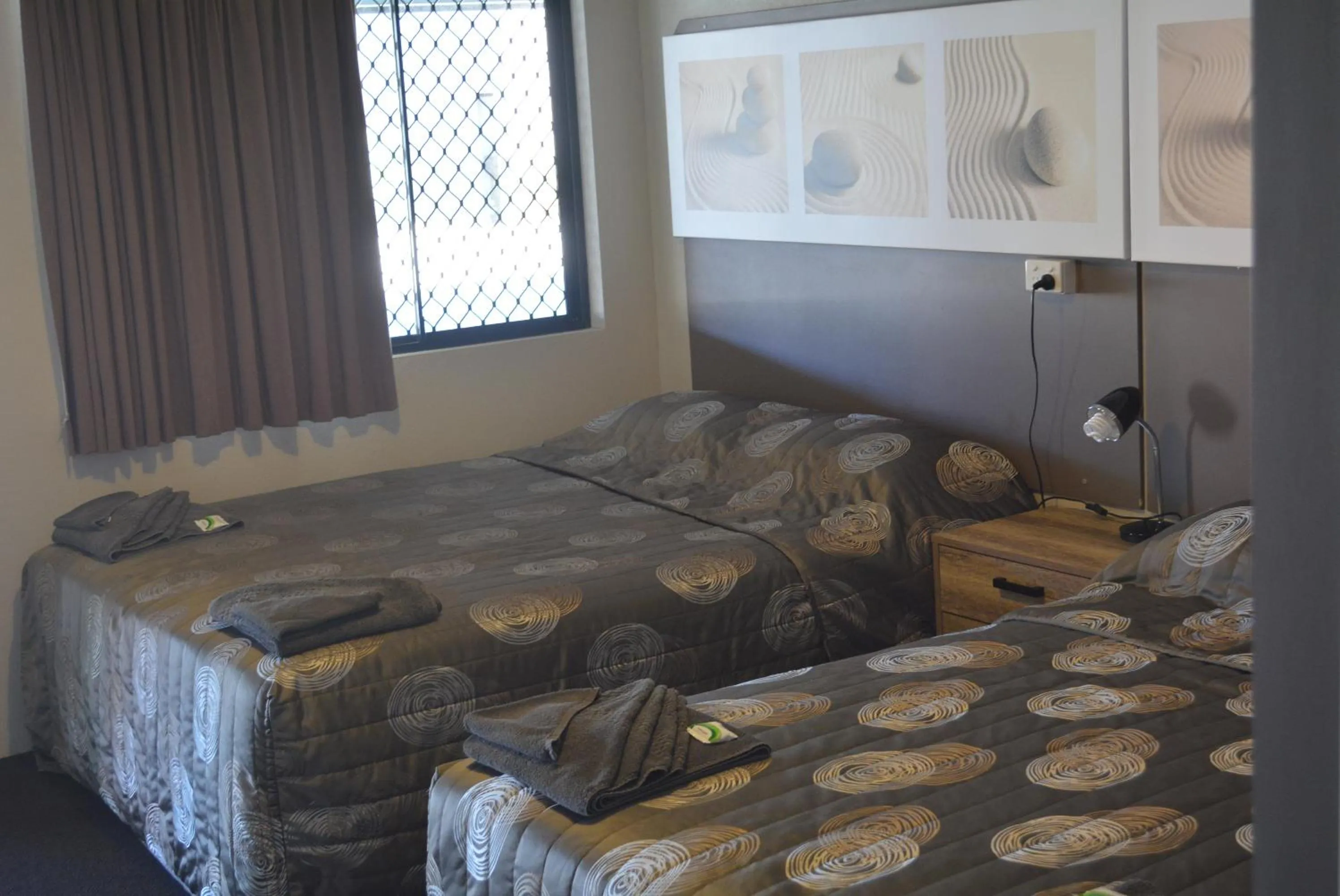 Bed in Carmila Sands Motel
