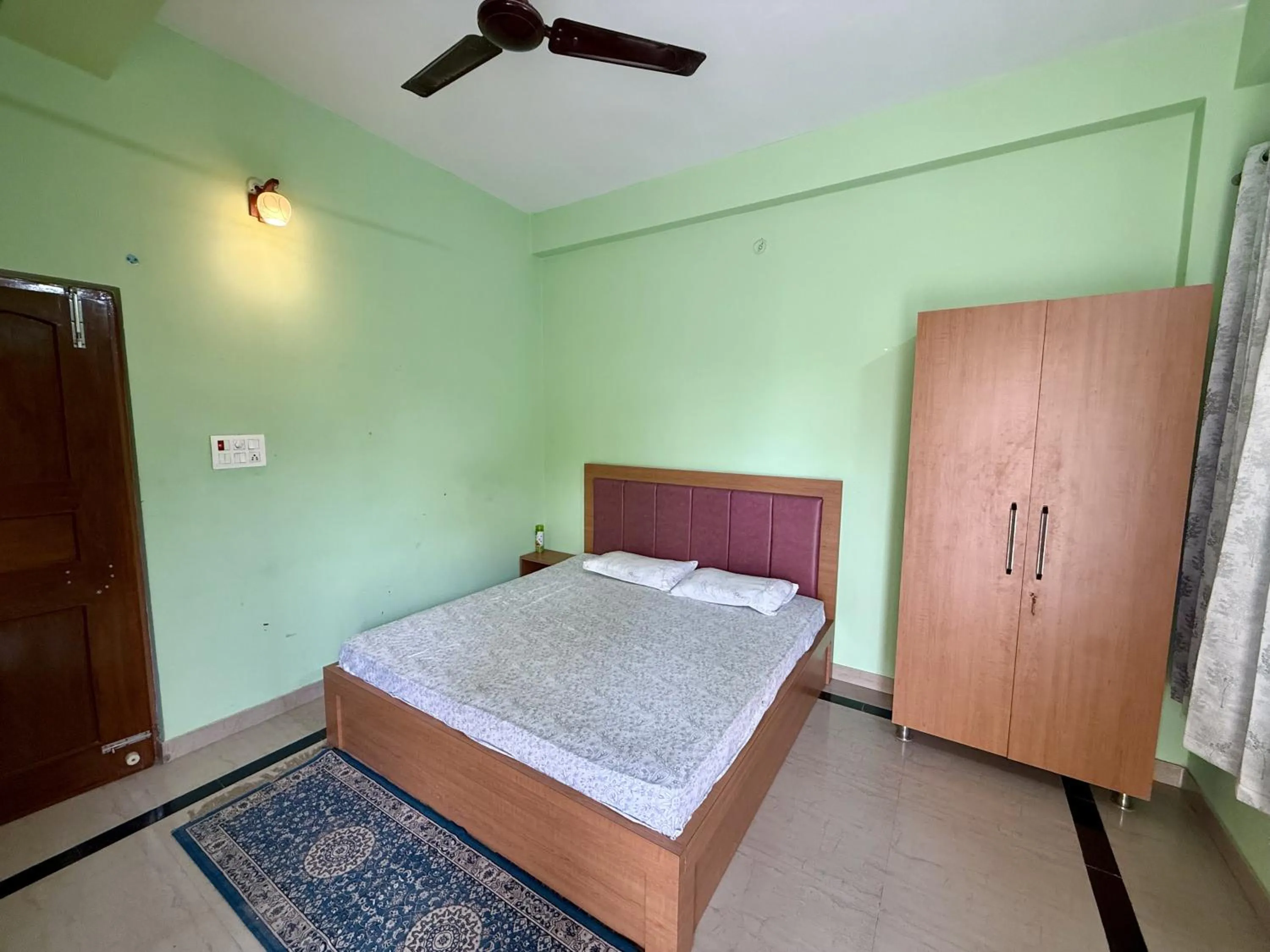 Bed in Madhuraj Villa Homestay