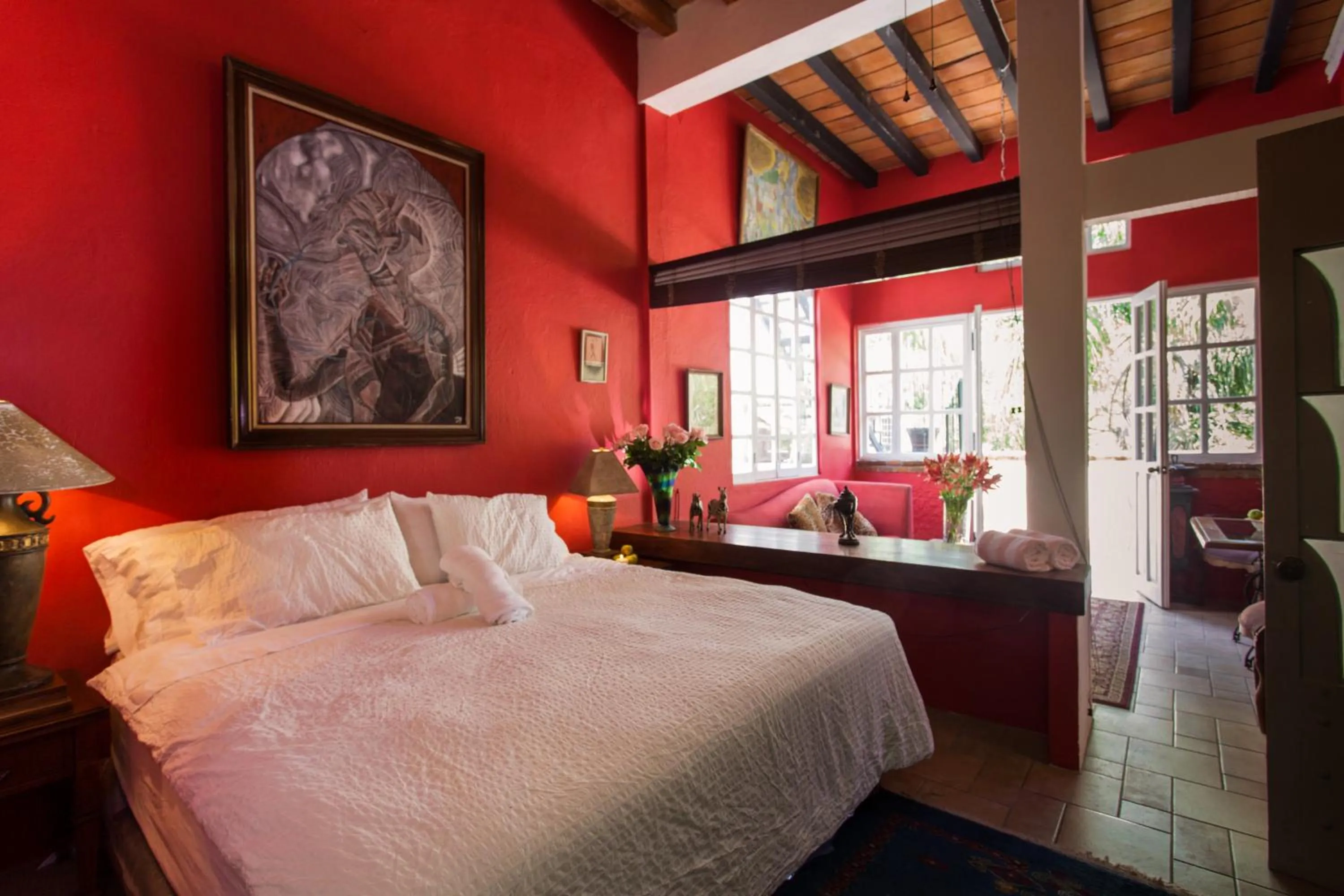 Bed in Garlands Del Rio Riverside Boutique Hotel