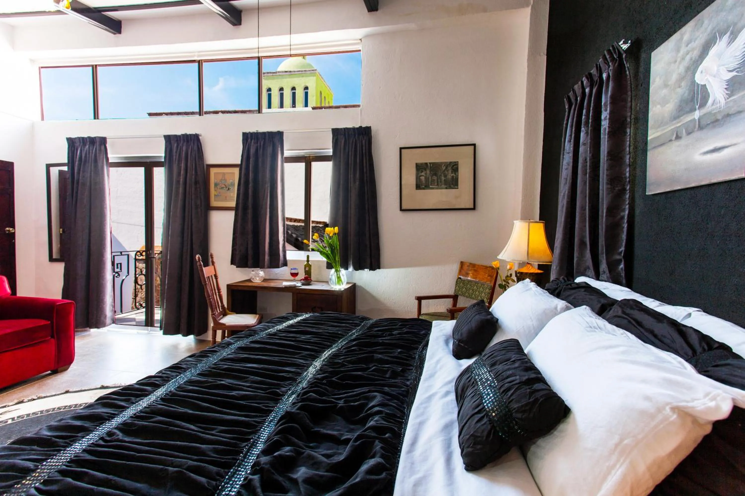 Bed in Garlands Del Rio Riverside Boutique Hotel