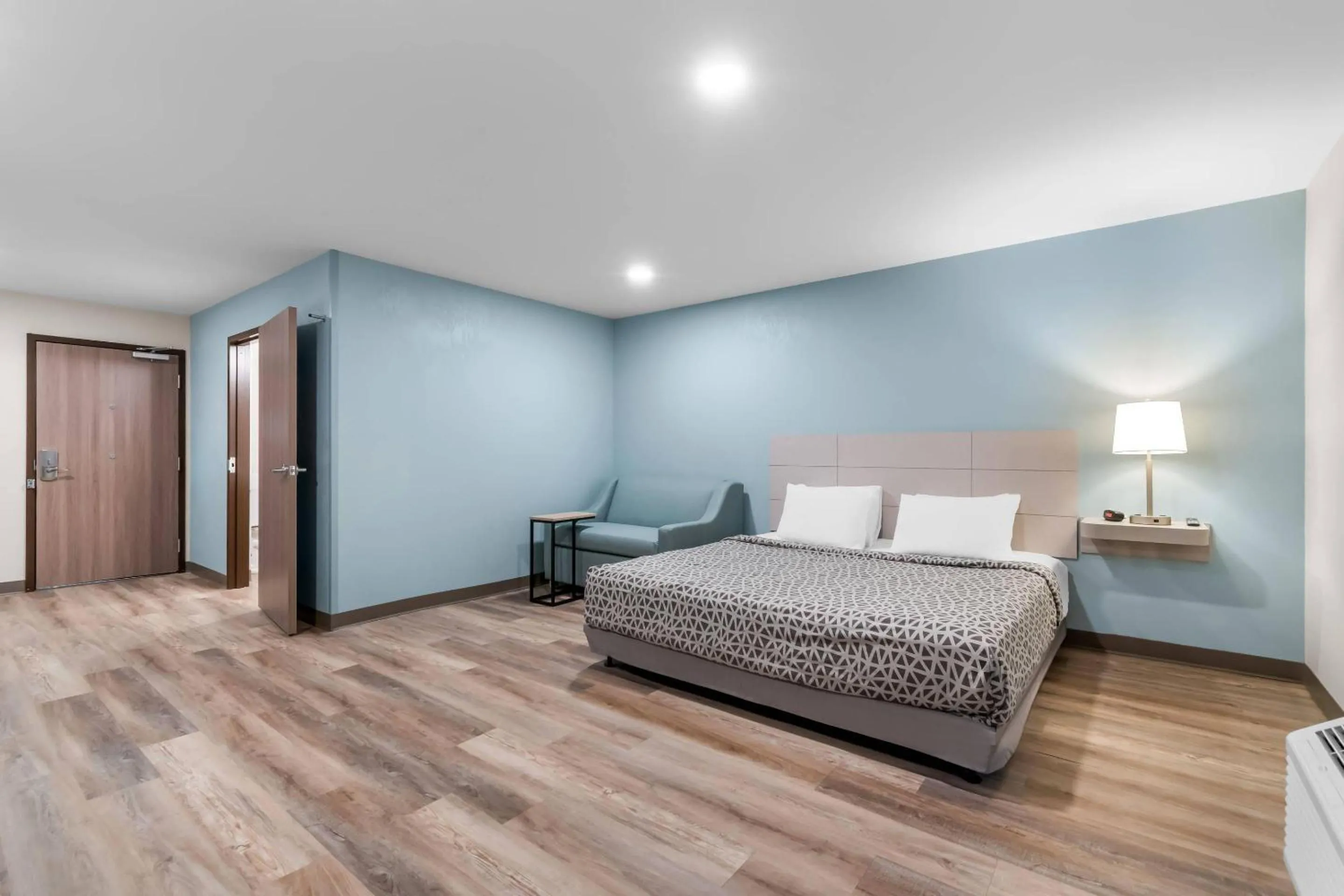 Bedroom, Bed in WoodSpring Suites Harrisburg Carlisle