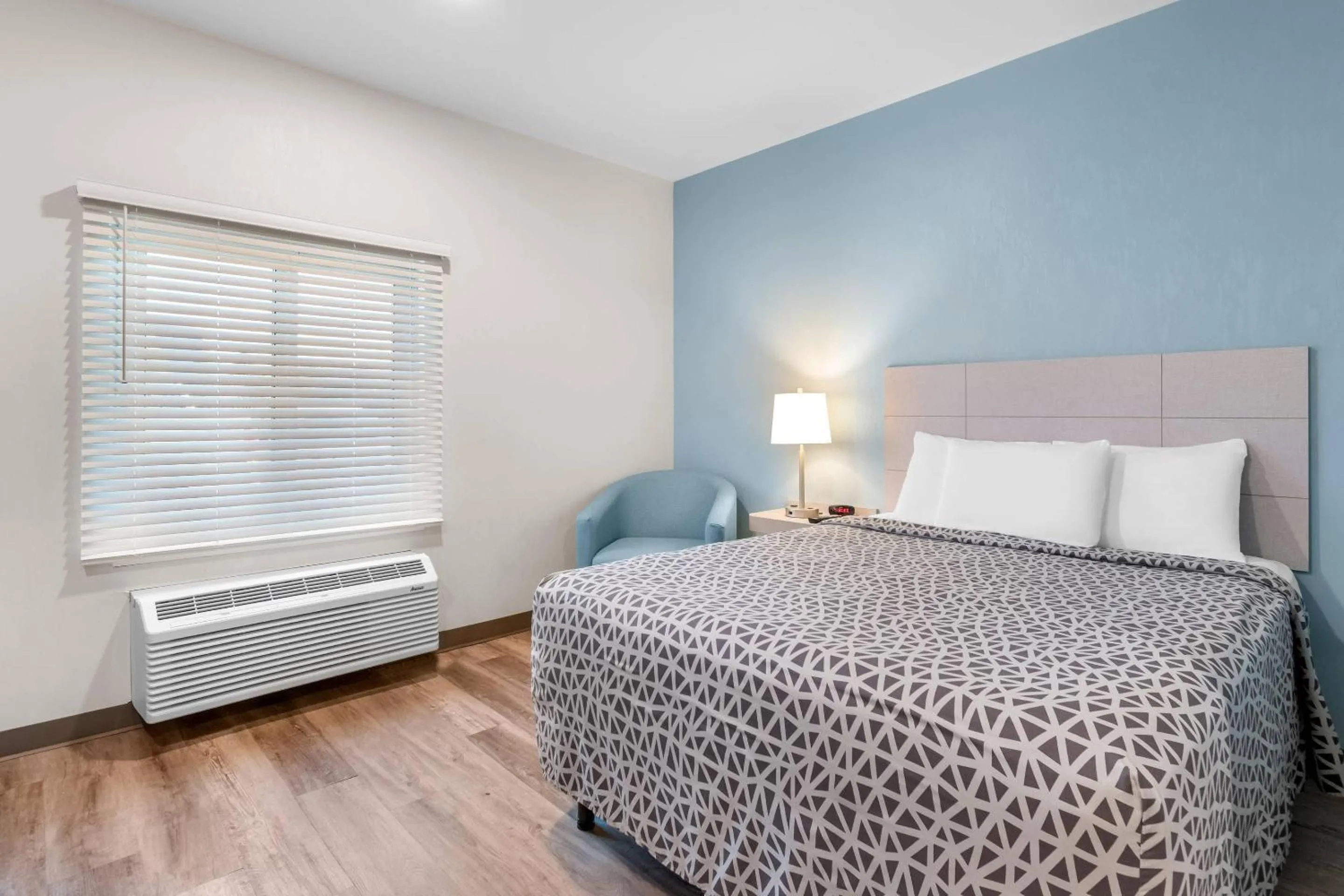 Bedroom, Bed in WoodSpring Suites Harrisburg Carlisle