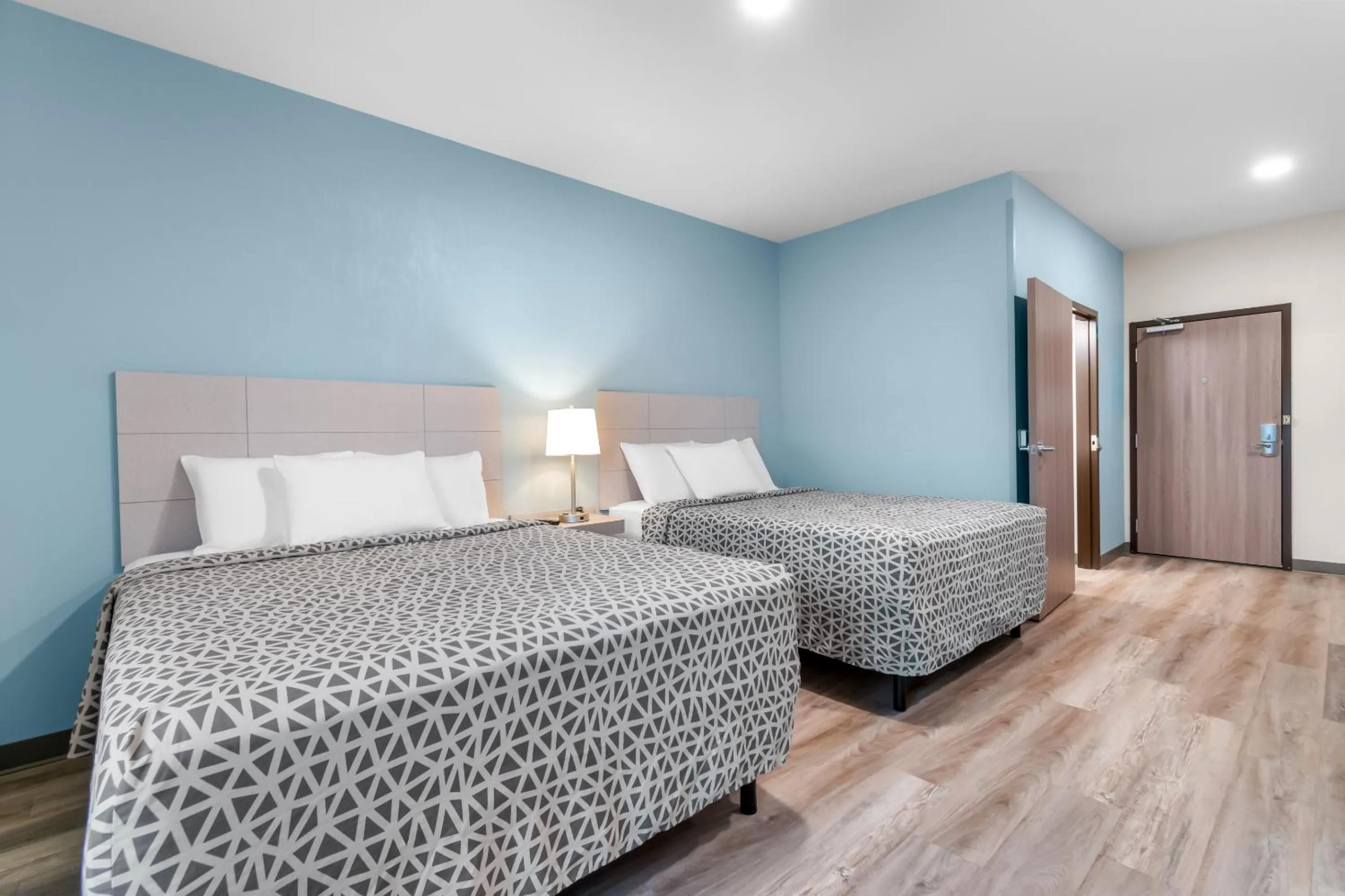 Bedroom, Bed in WoodSpring Suites Harrisburg Carlisle