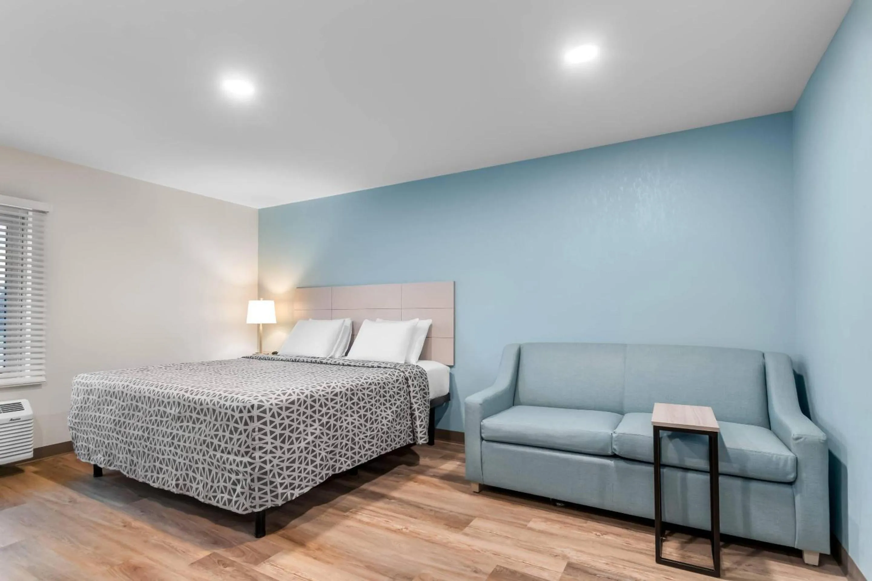 Bedroom, Bed in WoodSpring Suites Harrisburg Carlisle
